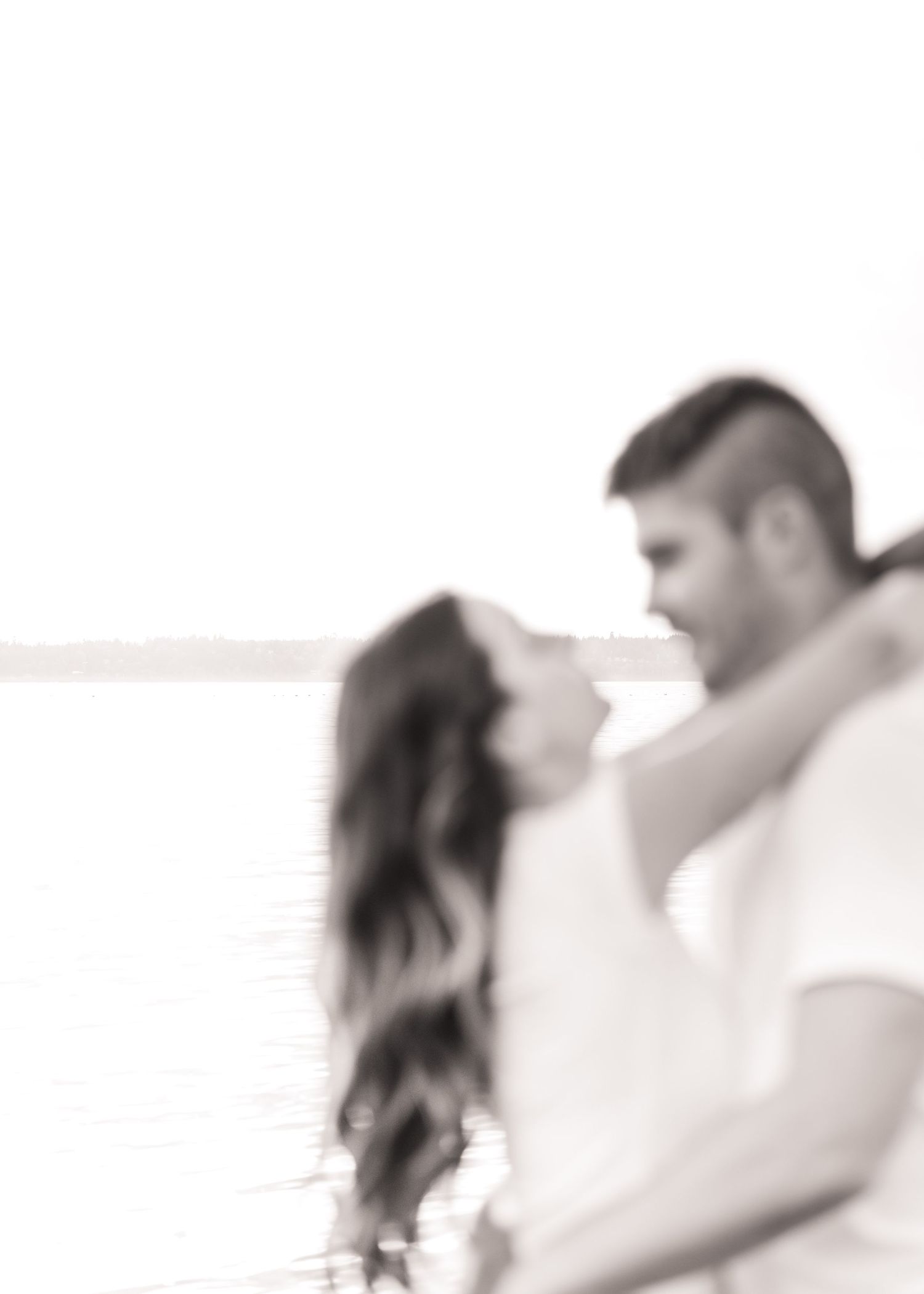 A romantic black and white photo sequence shows a couple embracing and sharing intimate moments together.
