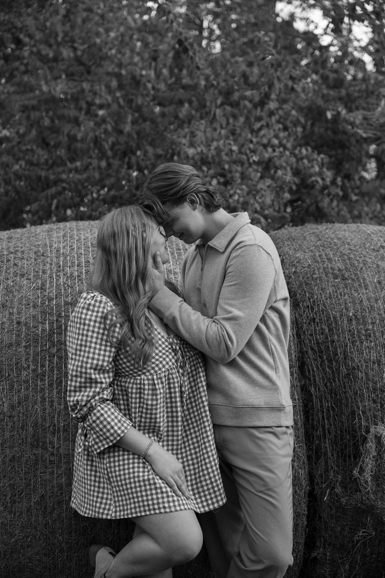 Fall outdoor golden hour engagement photos in front of hay bails Funks Grove, Illinois