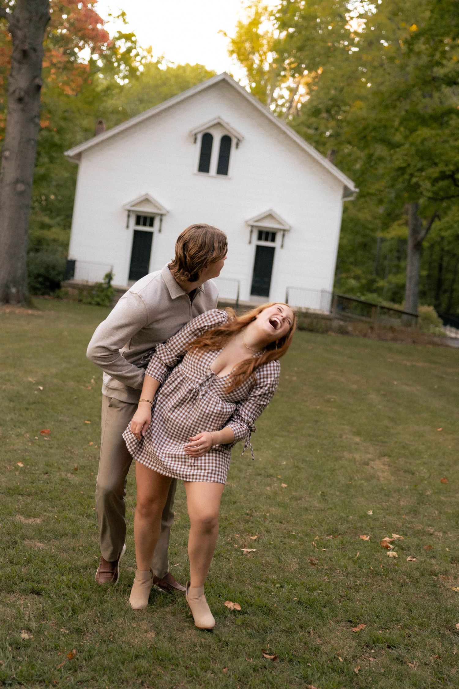 Fall outdoor golden hour engagement photos in front of chapel in Funks Grove, Illinois