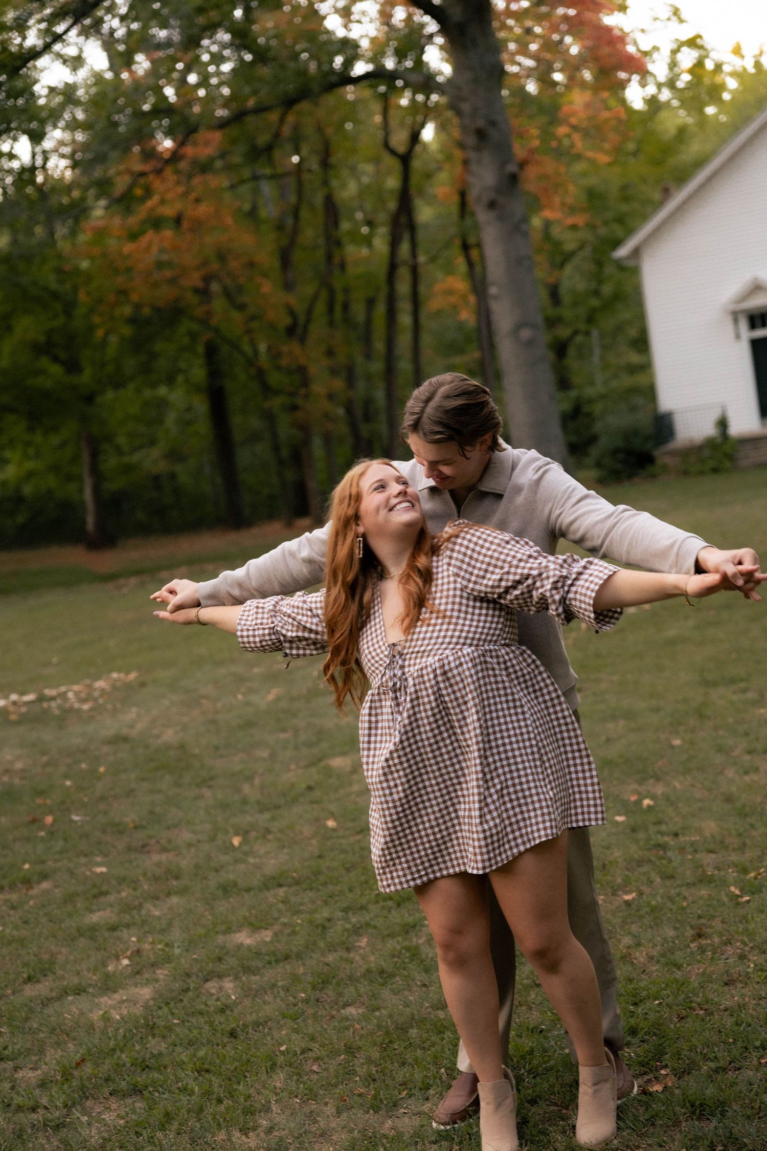 Fall outdoor golden hour engagement photos in front of chapel in Funks Grove, Illinois