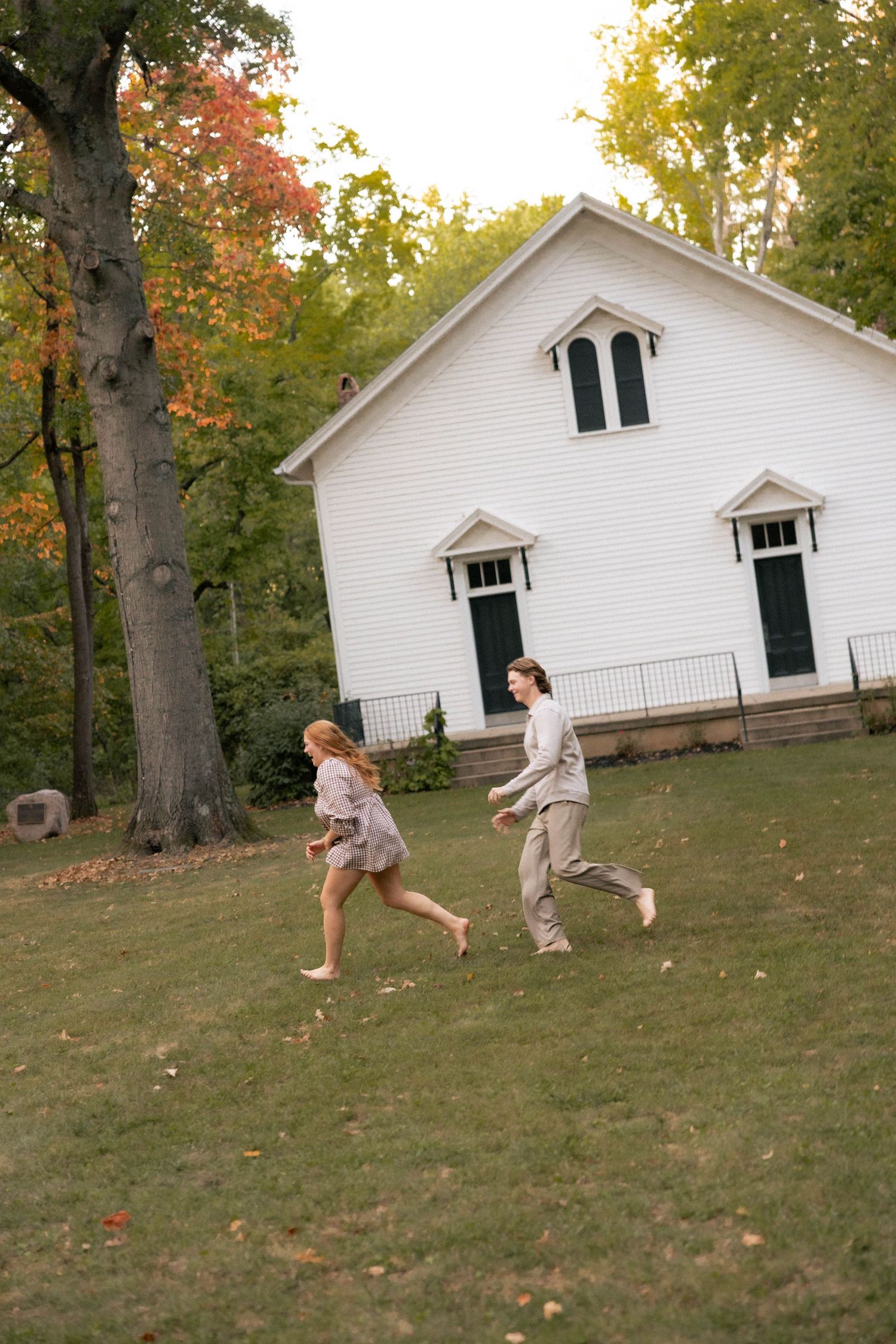 Fall outdoor golden hour engagement photos in front of chapel in Funks Grove, Illinois