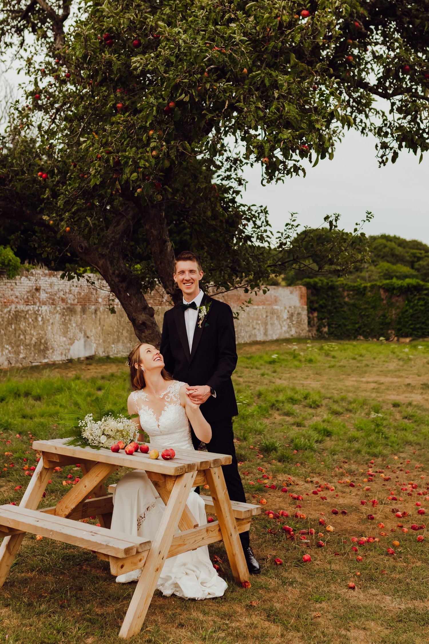 Wedding couple together at Titchfield Abbey, celebrating their special day in a natural and candid moment.