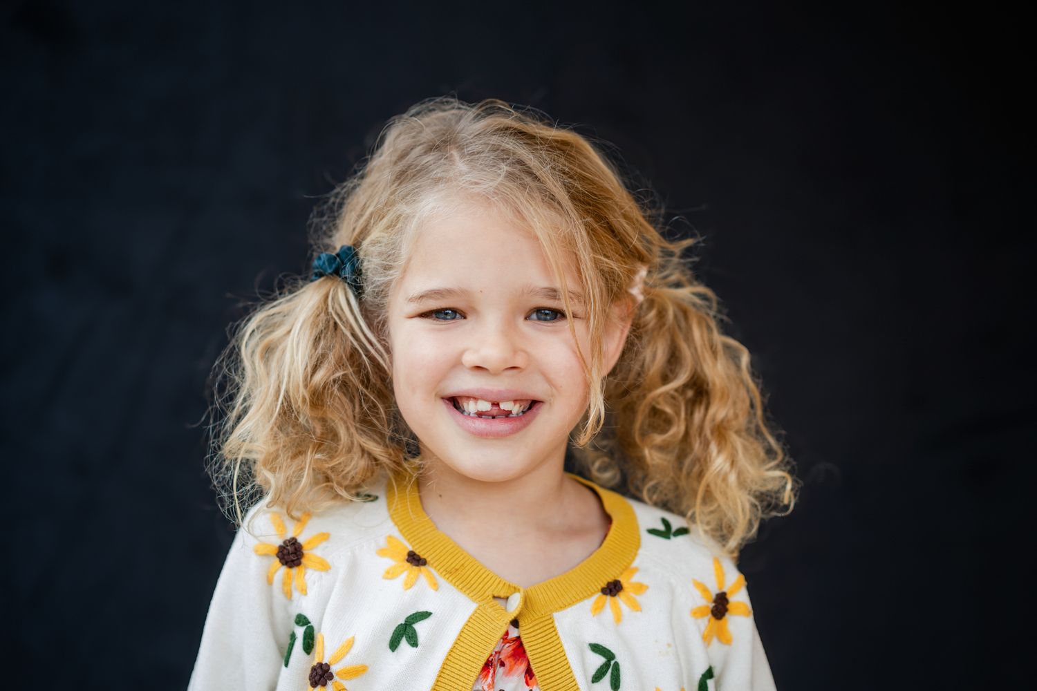 fine art school portrait of a young girl with a sweater with yellow daisies