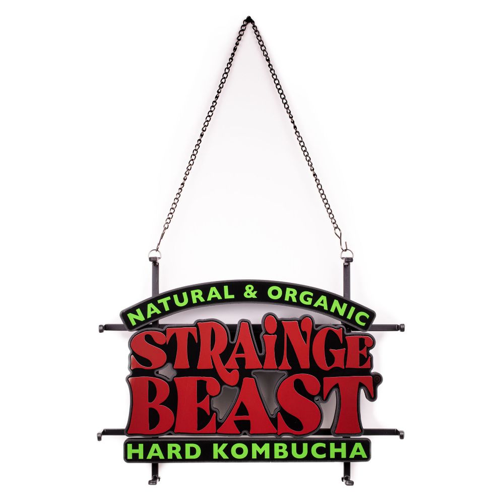 Strange Beast Hard Kombucha hanging sign with red and green retro style lettering.