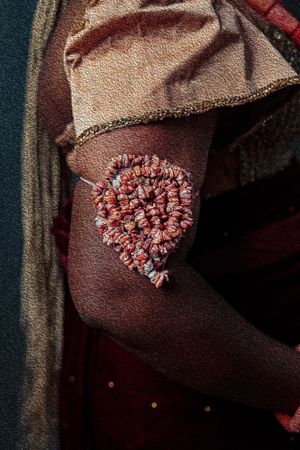 Photography Oil painting Close-up of coral beaded embellishment worn by Rivers Bride