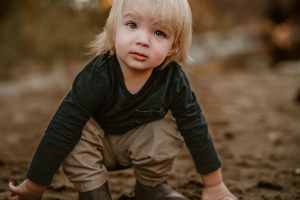A candid outdoor portrait session with natural earth tones and warm lighting.