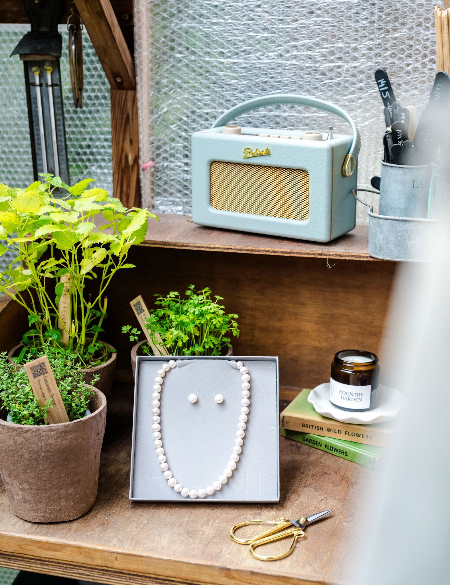 lifestyle product image in greenhouse location in Kent of jewellery for creative artisan website