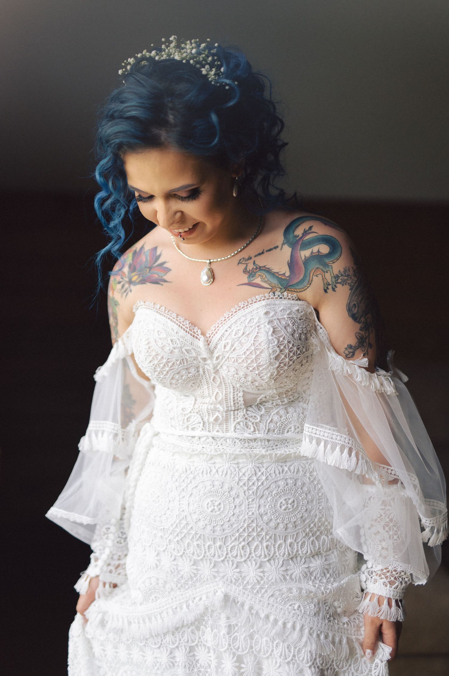 Close-up detail shots of an elegant white lace wedding dress with sweetheart neckline and intricate embroidered patterns.