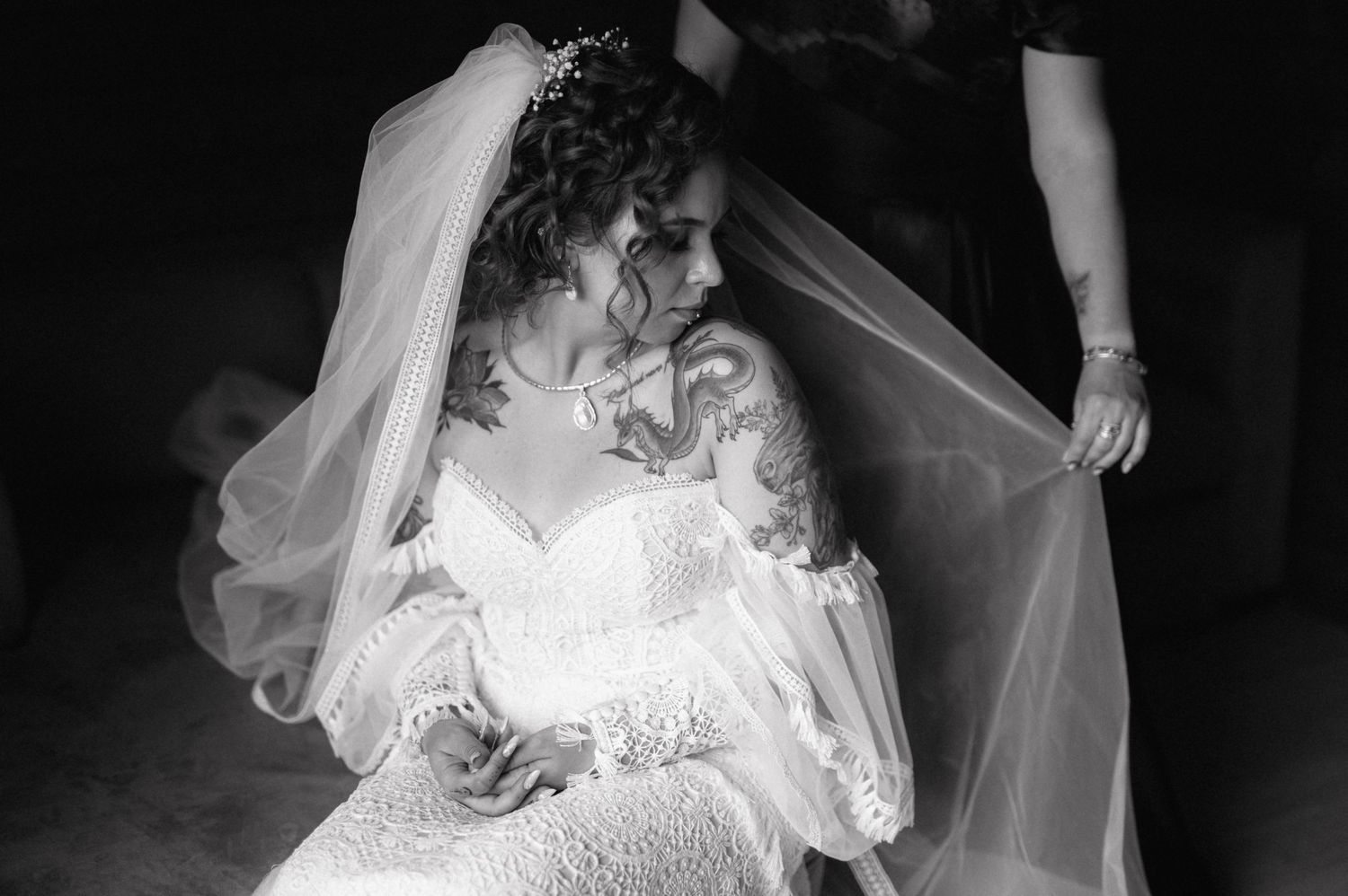 Black and white series of romantic wedding dress photos showing the delicate details of a lace bridal gown.