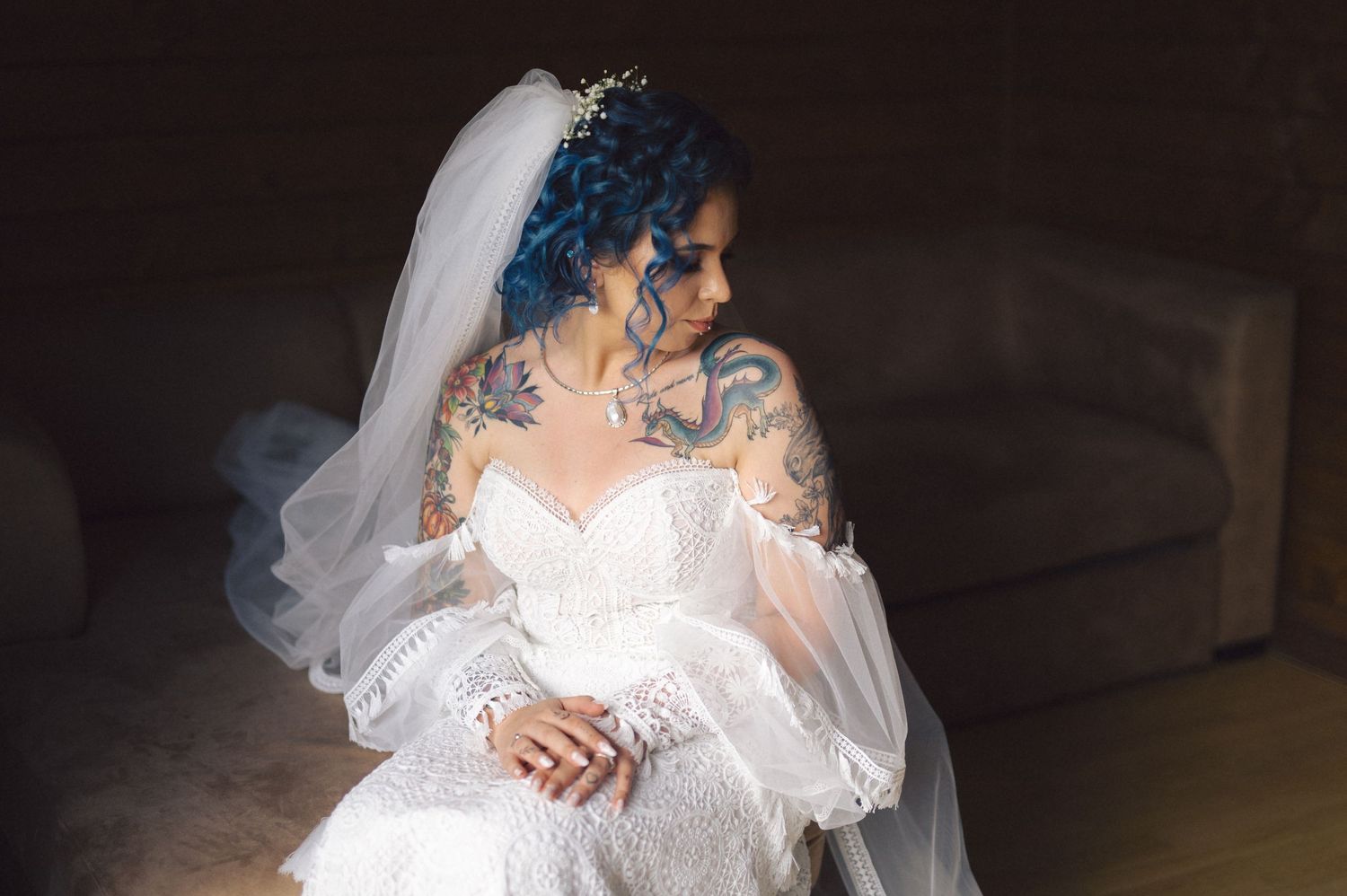 A series of fanned out wedding photos shows a bride in a white dress from various angles in a dark setting.