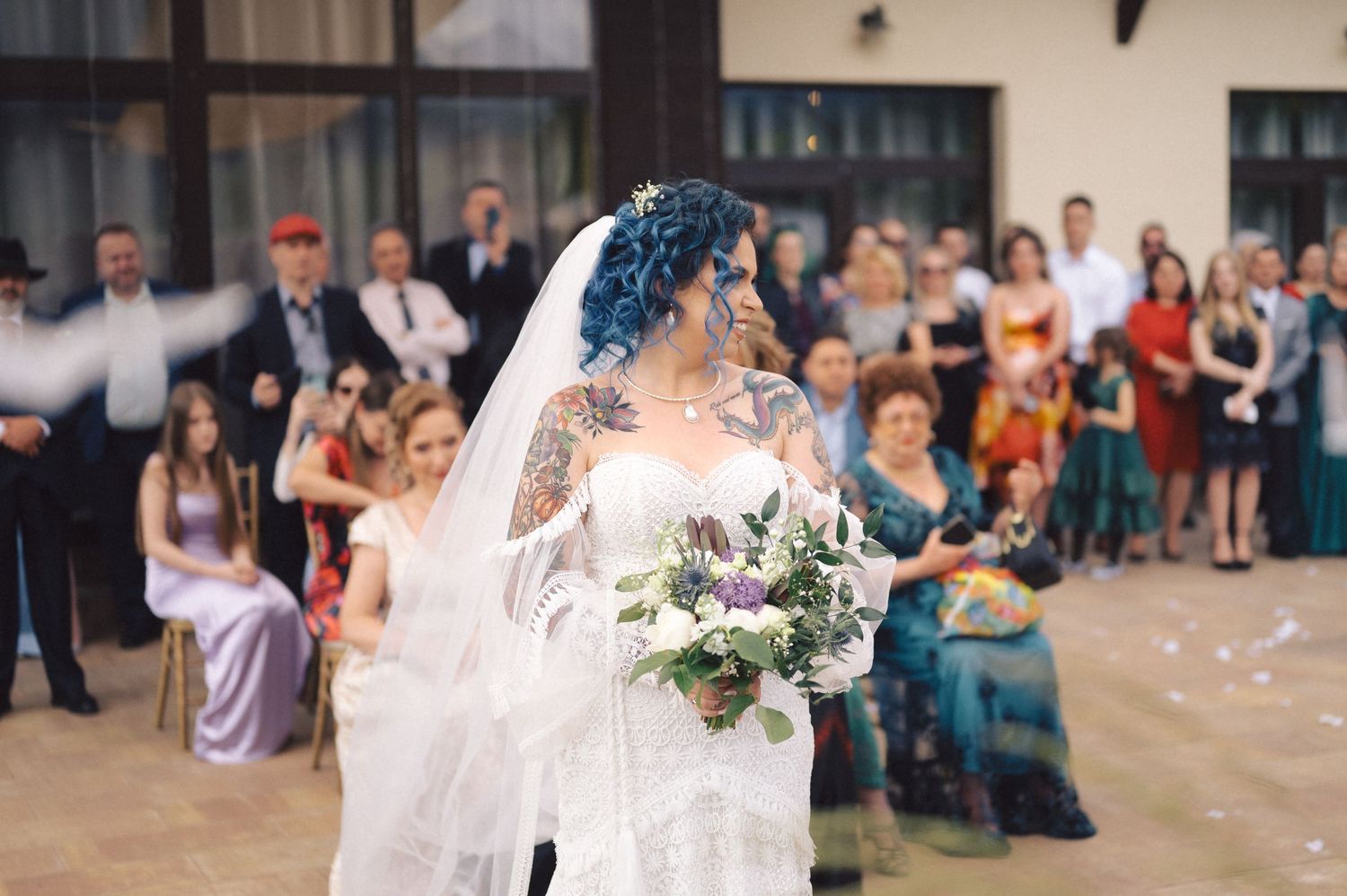 Grid of candid wedding celebration moments showing dancing, toasts, and joyful guests at an indoor reception venue.