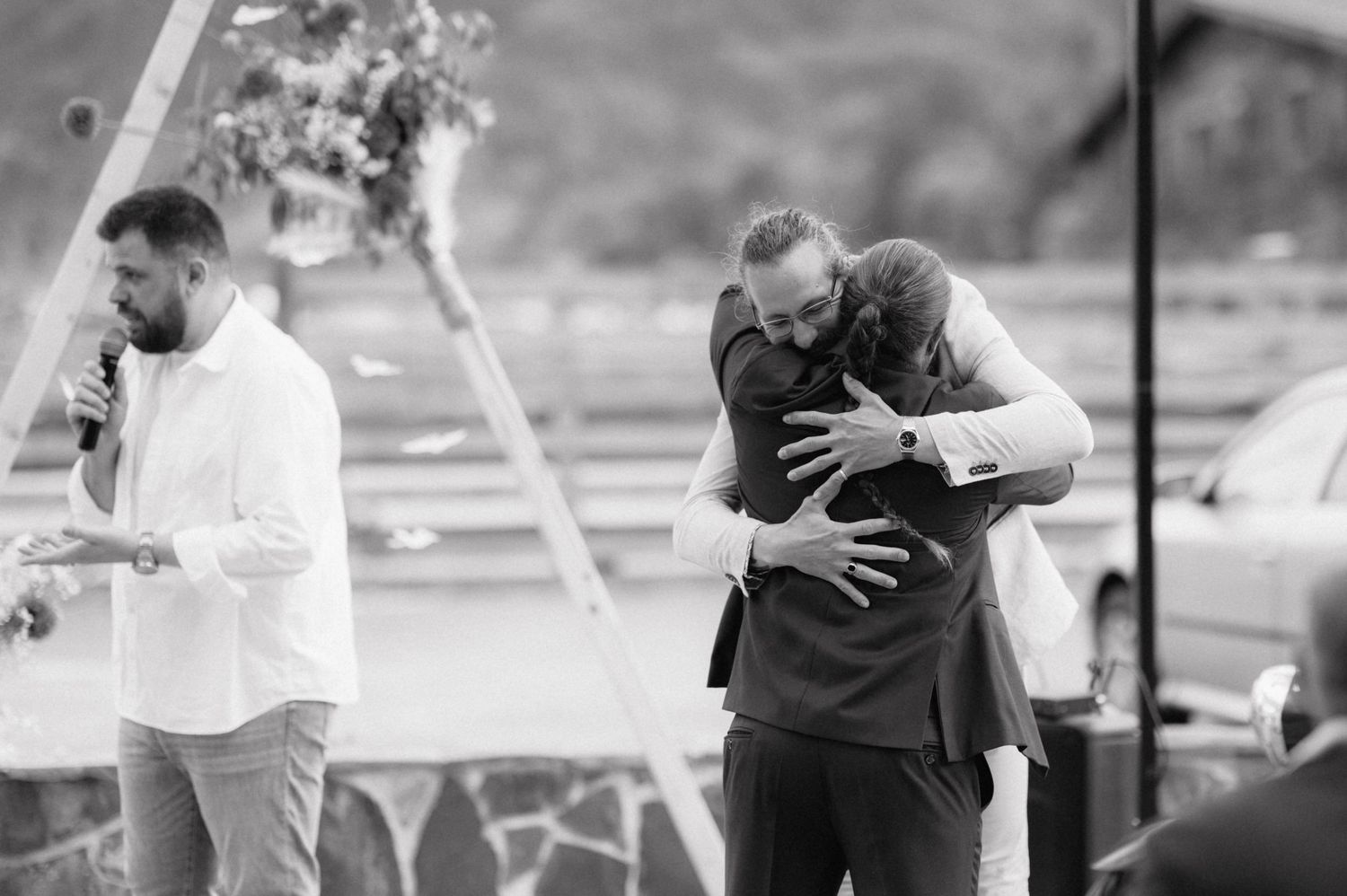 Black and white photo strip showing romantic couple in chronological sequence embracing and coming together.