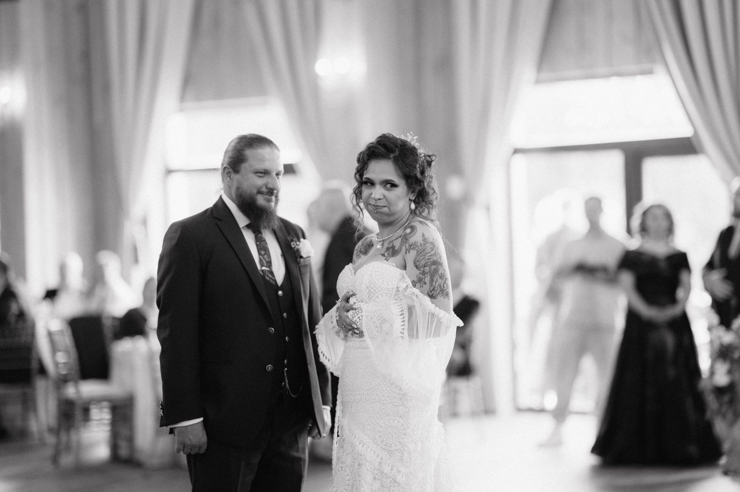 A collection of black and white wedding photographs showing joyful moments during a formal indoor reception.