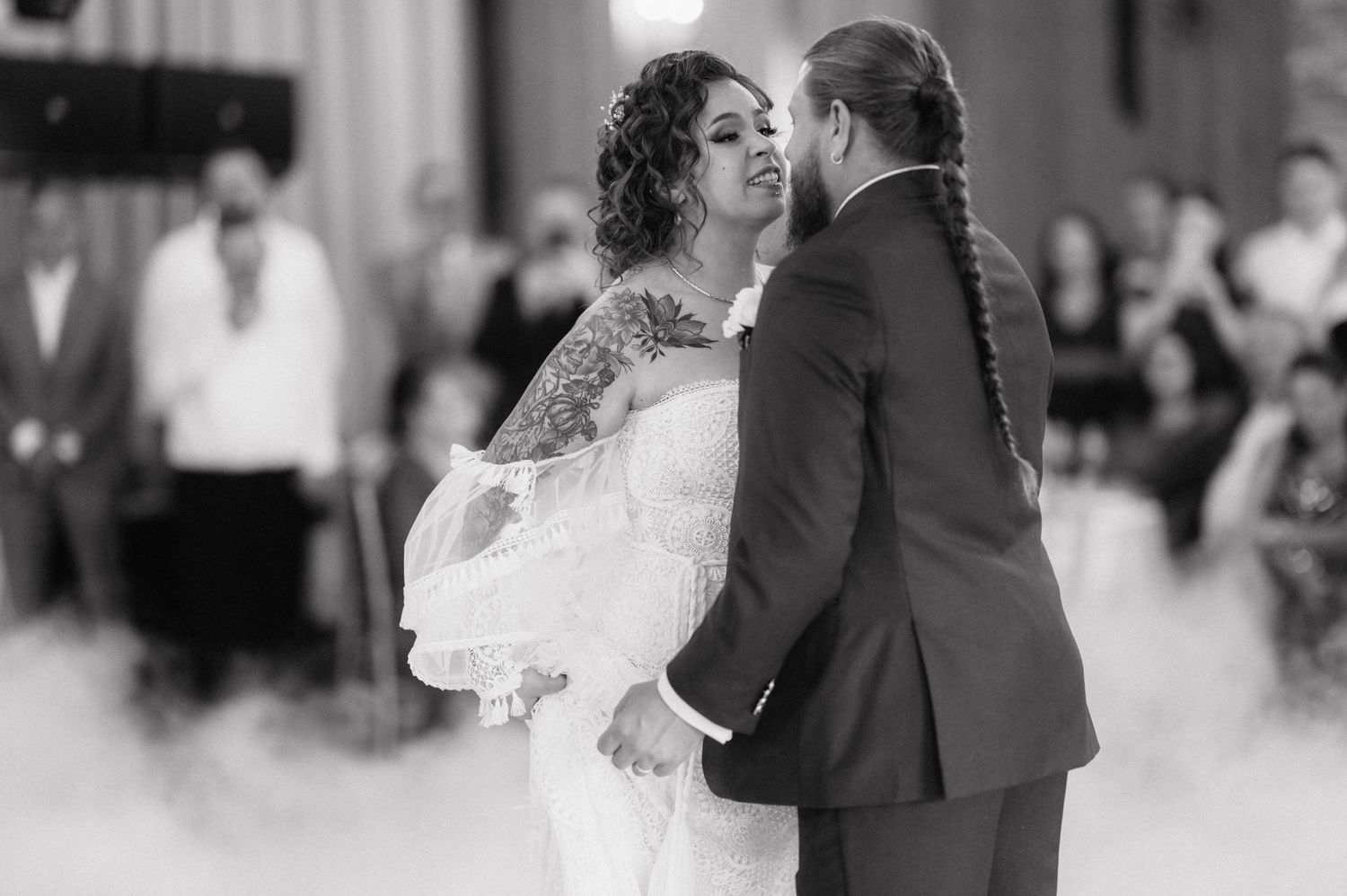 A romantic black and white collage of a bride and groom dancing together at their wedding reception.