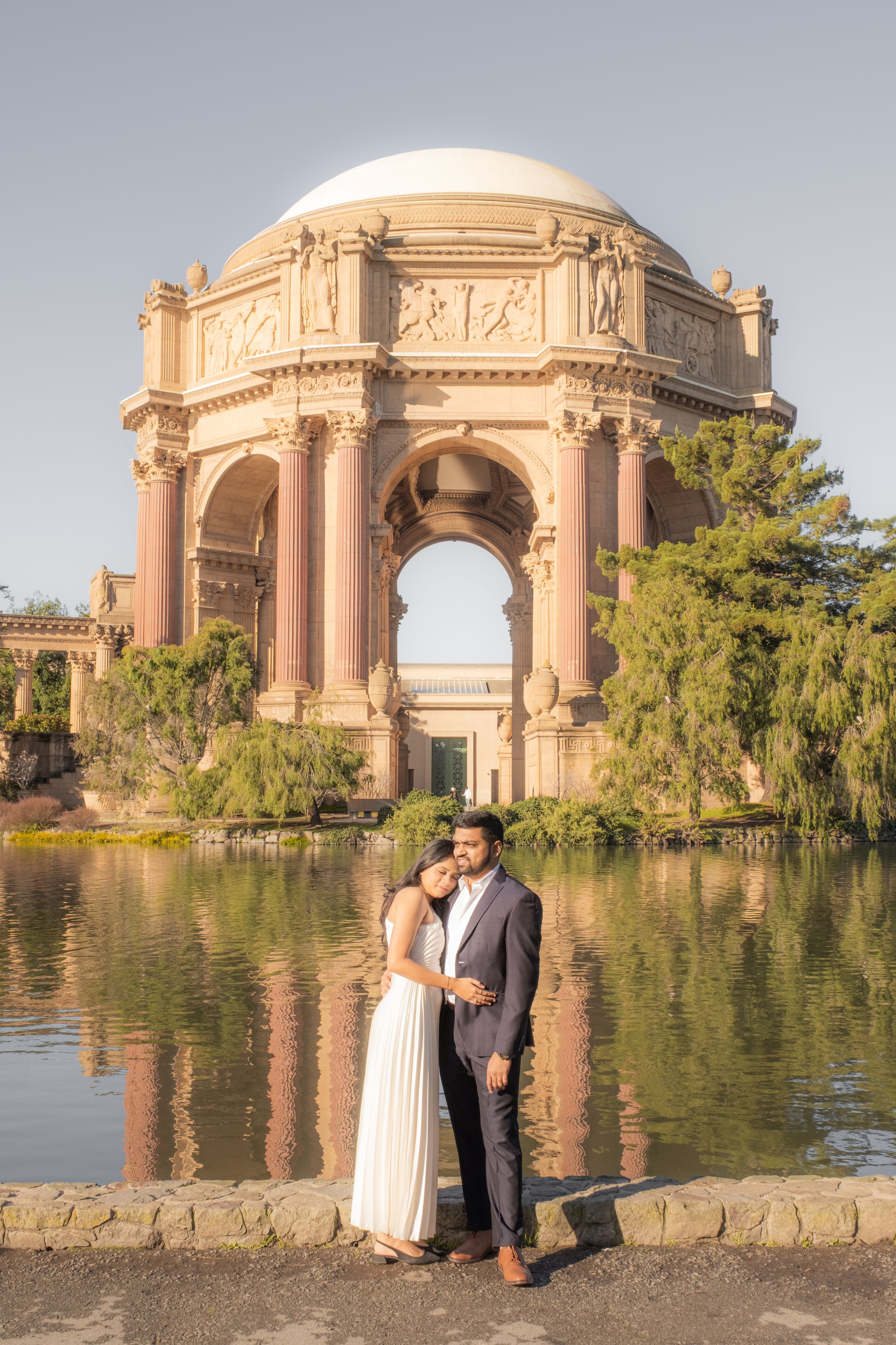 engaged couple candid moment at the Palace of Fine Arts.