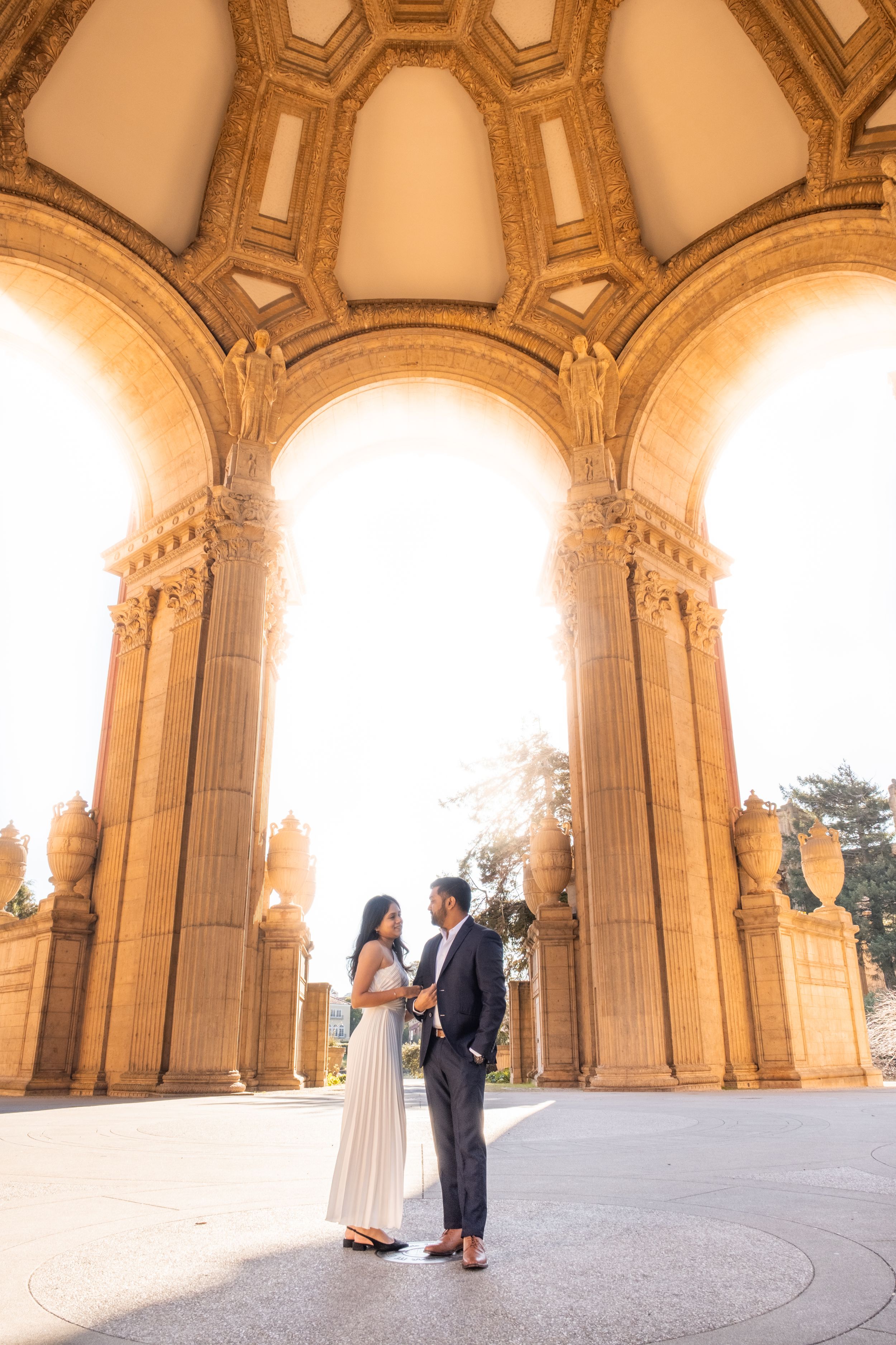 engaged couple candid moment at the Palace of Fine Arts.
