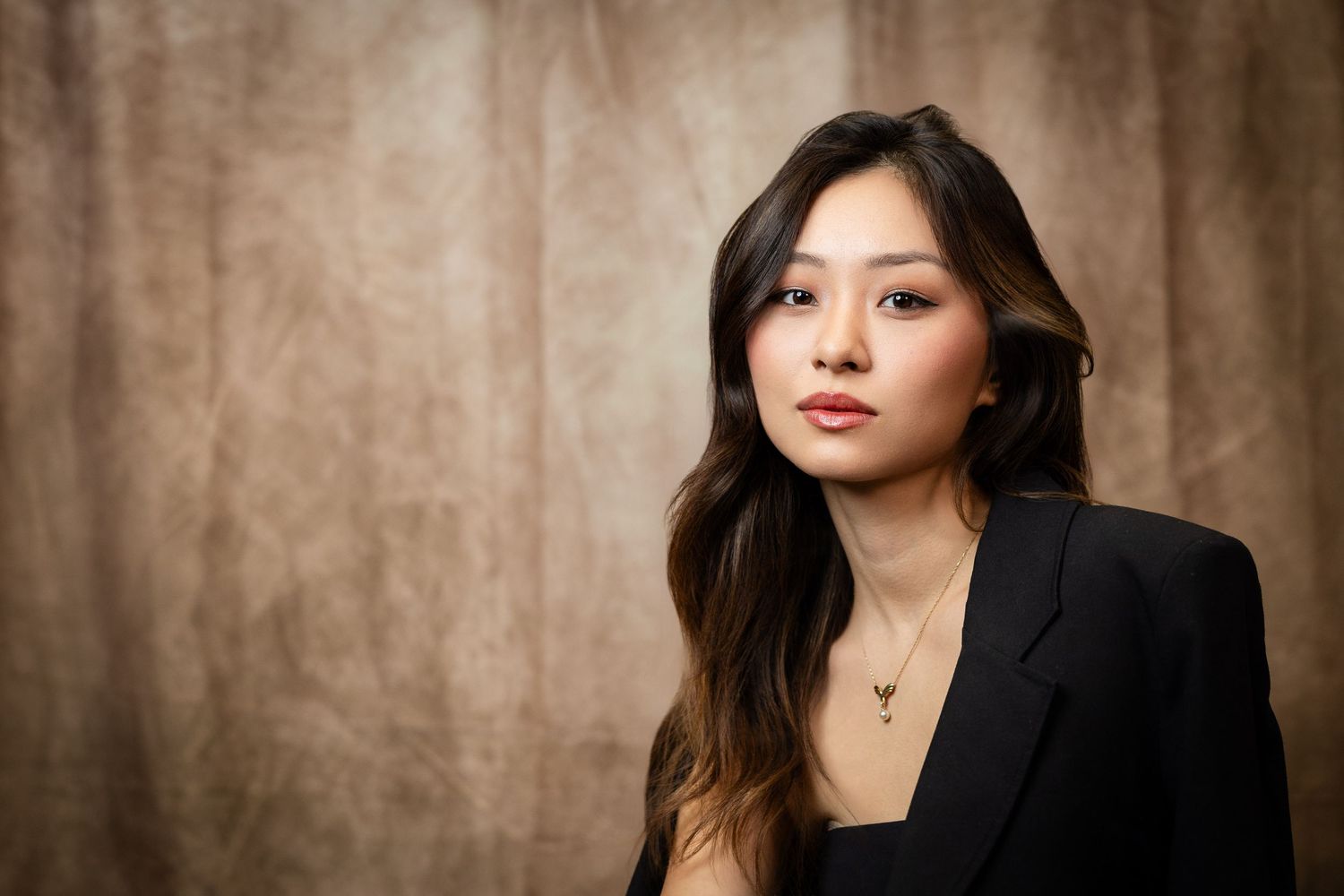 Professional headshots on brown backdrop showing confident poses and expressions.