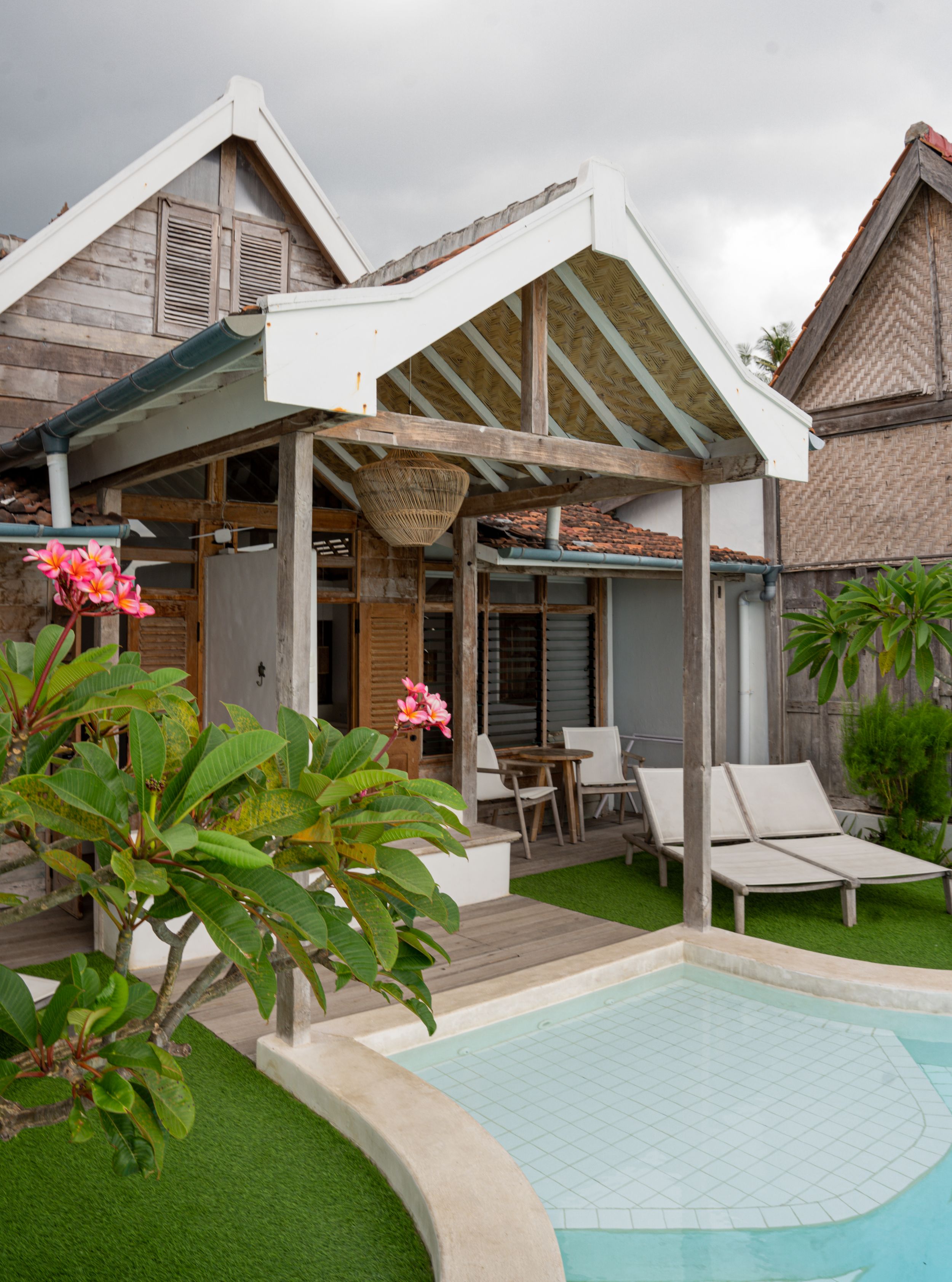 Modern vacation villas with private pools and tropical landscaping in a luxury resort setting.