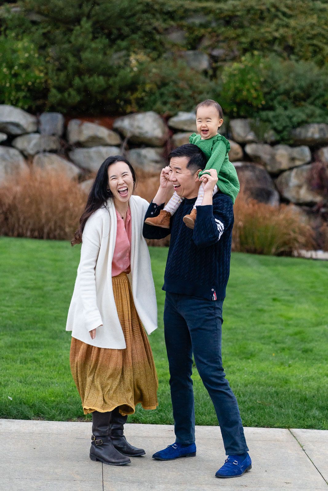Everyone smiling for a posed family photo.