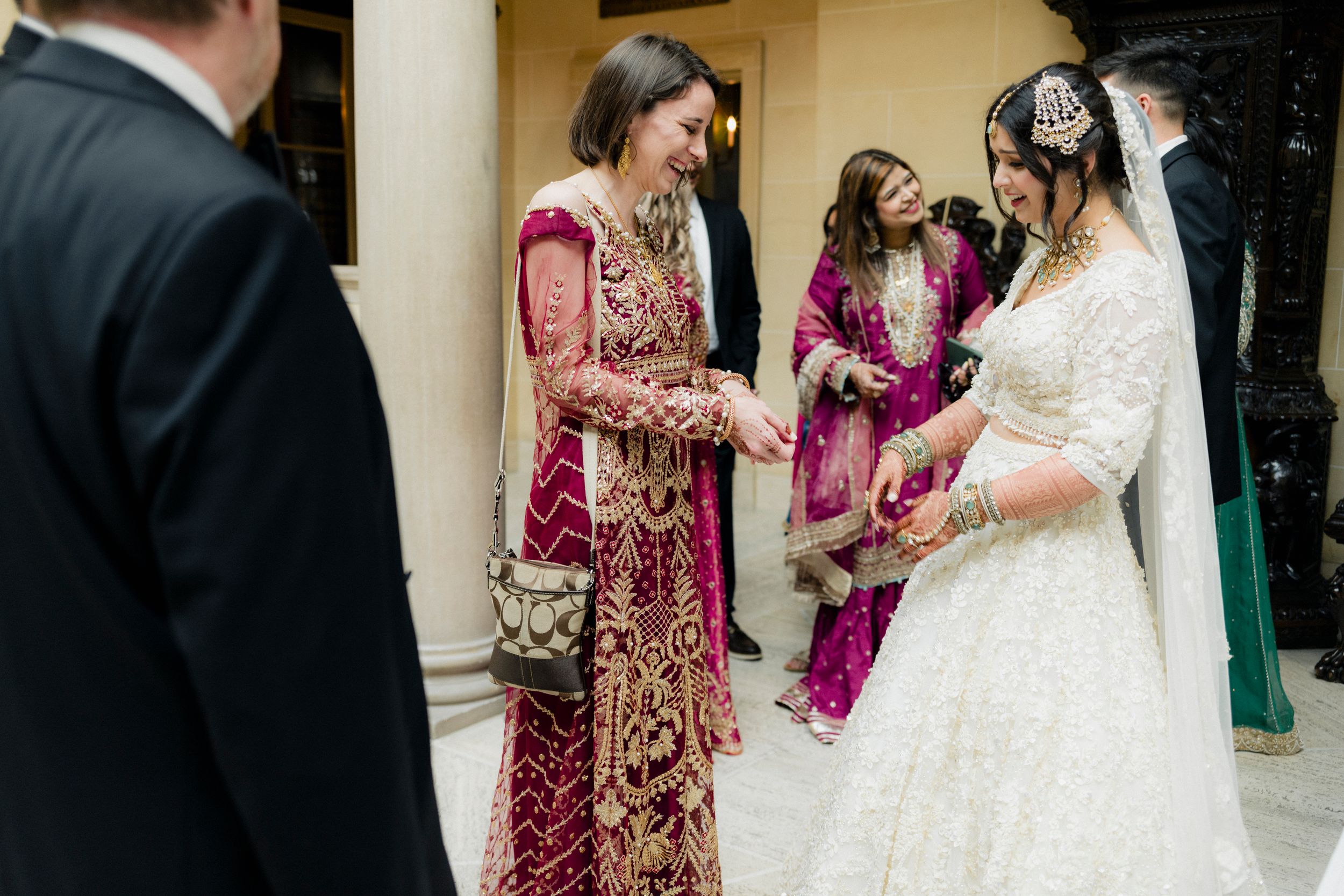 A bride greets friends at Cuneo Mansion wedding.