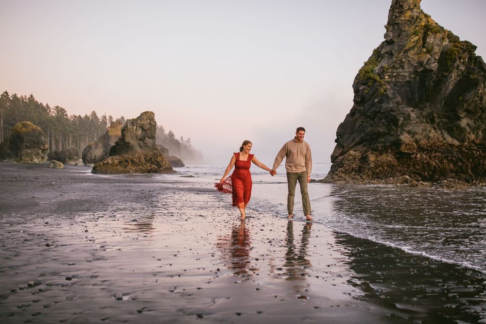 husband and wife together during their family adventure photography session at Ruby Beach in Olympic National Park near Seattle, Washington