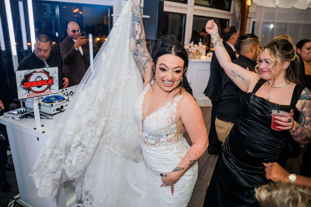 Joyful celebration on the dance floor at an elegant wedding reception.