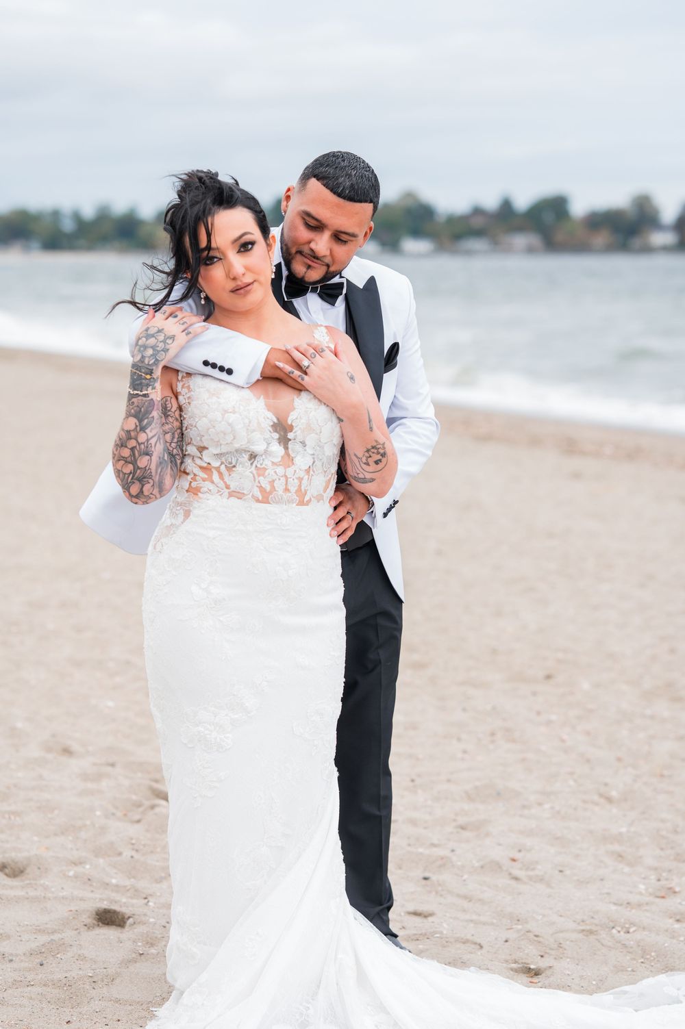 Romantic beachside wedding photos capturing intimate moments between newlyweds on sandy shore.