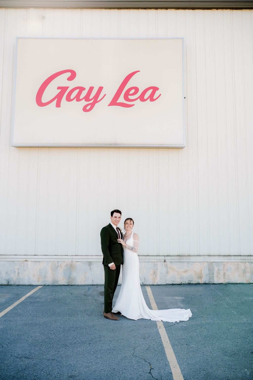 Minimalist wedding photo series showing a couple against a white wall with pink text in three sequential frames.