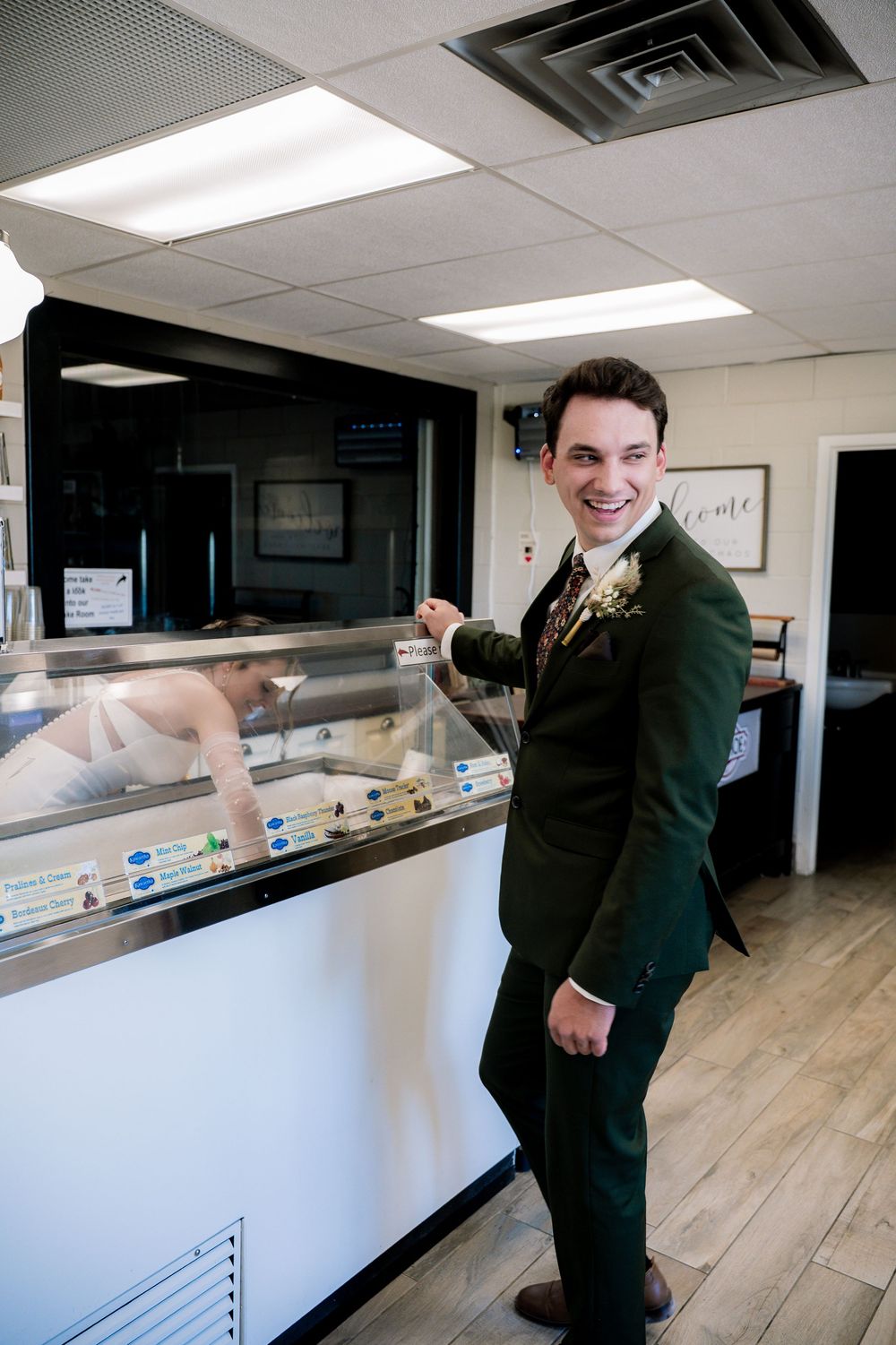 A series of photos showing a person in a dark suit interacting with a white reception desk in an office setting.