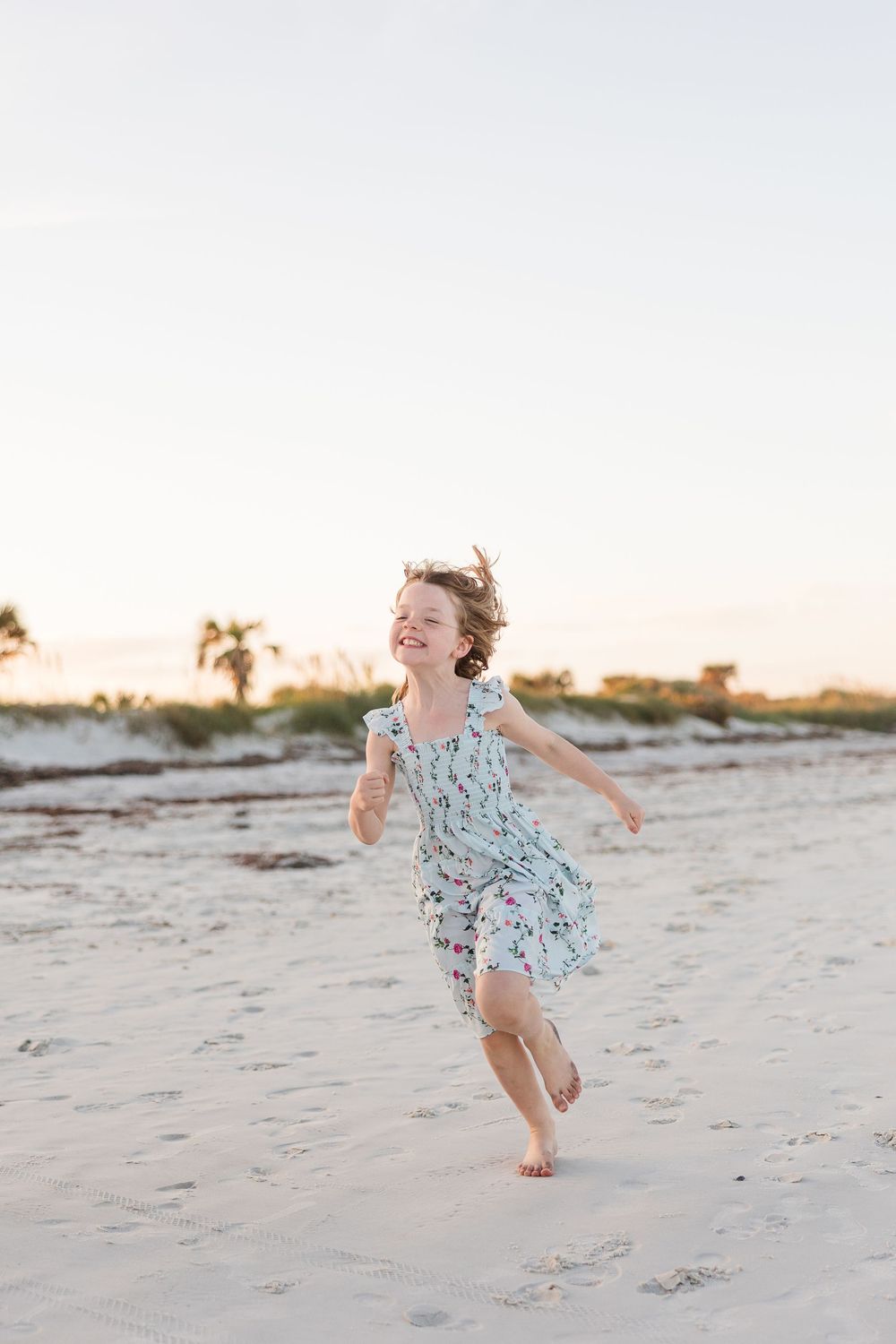 Joyful movement captured in a series of photos showing dancing and jumping on a sandy beach at sunset.
