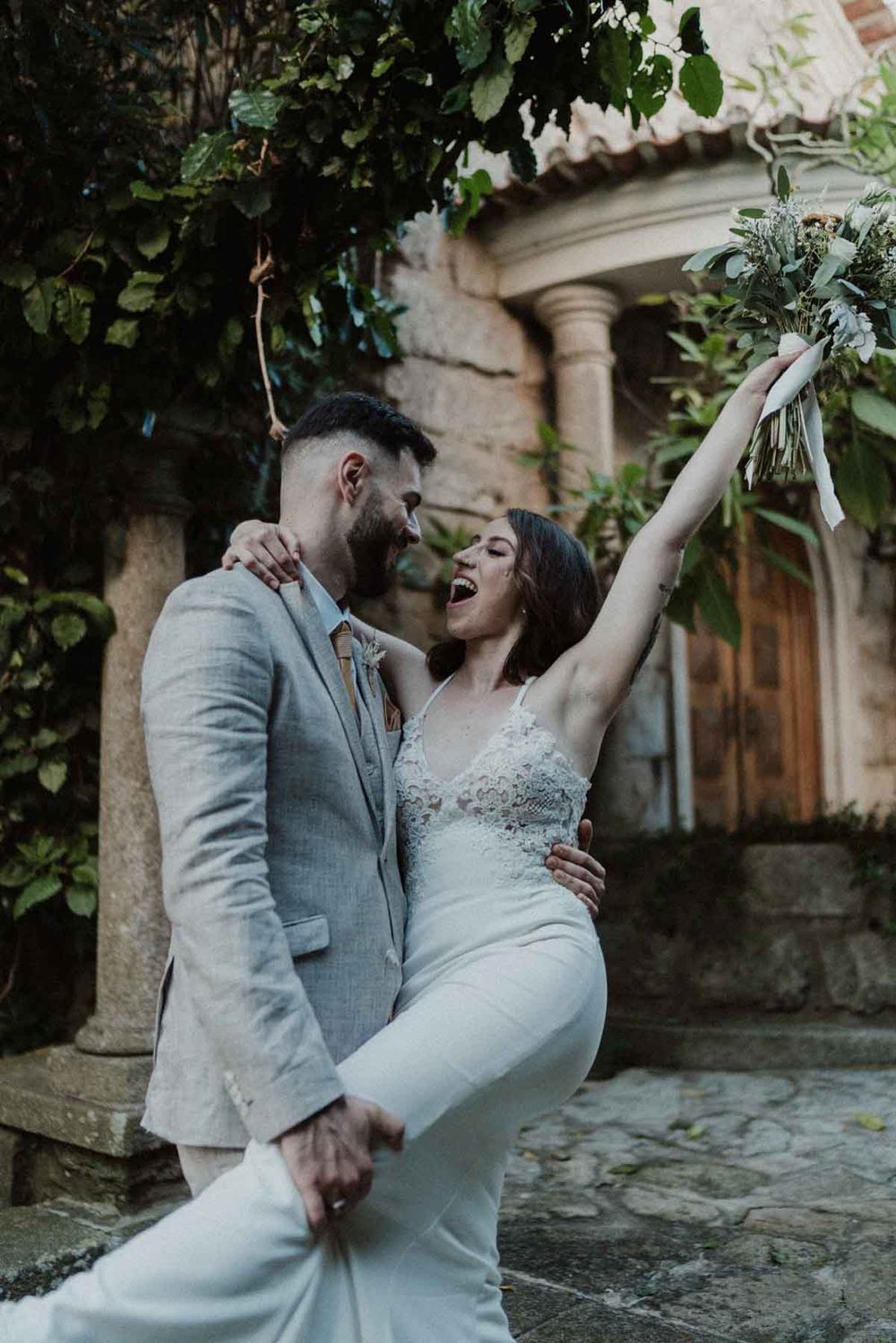 bride raising arms outdoor wedding portrait porto