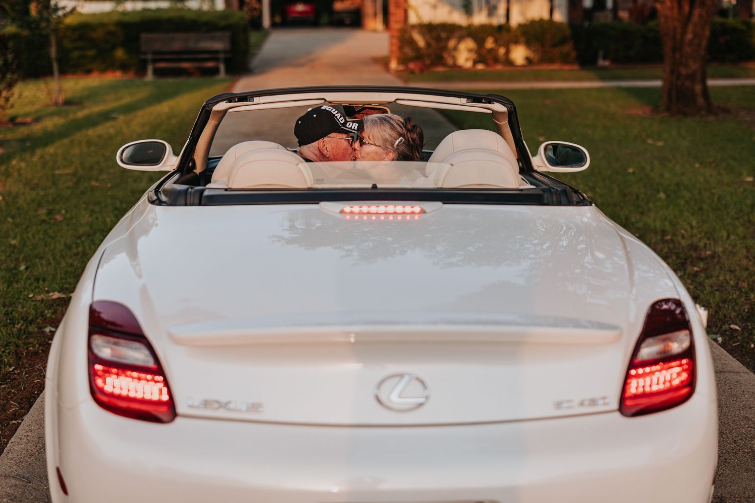 White luxury convertible car photographed from multiple angles at sunset.