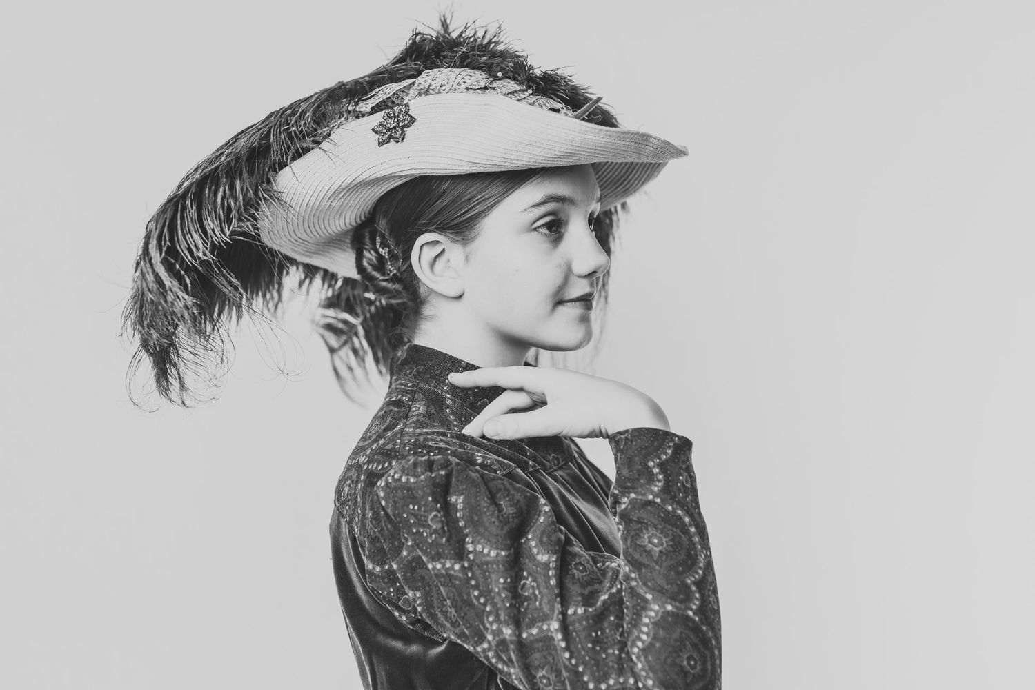 Four vintage black and white photographs showing different angles of a woman wearing Victorian era dress and hairstyle.