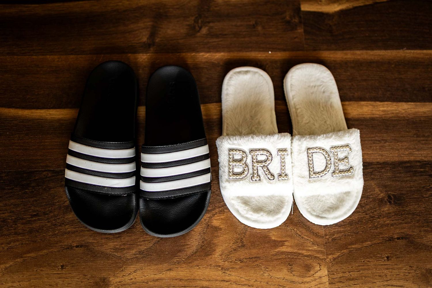 Collection of casual and formal shoes arranged on wooden surface.