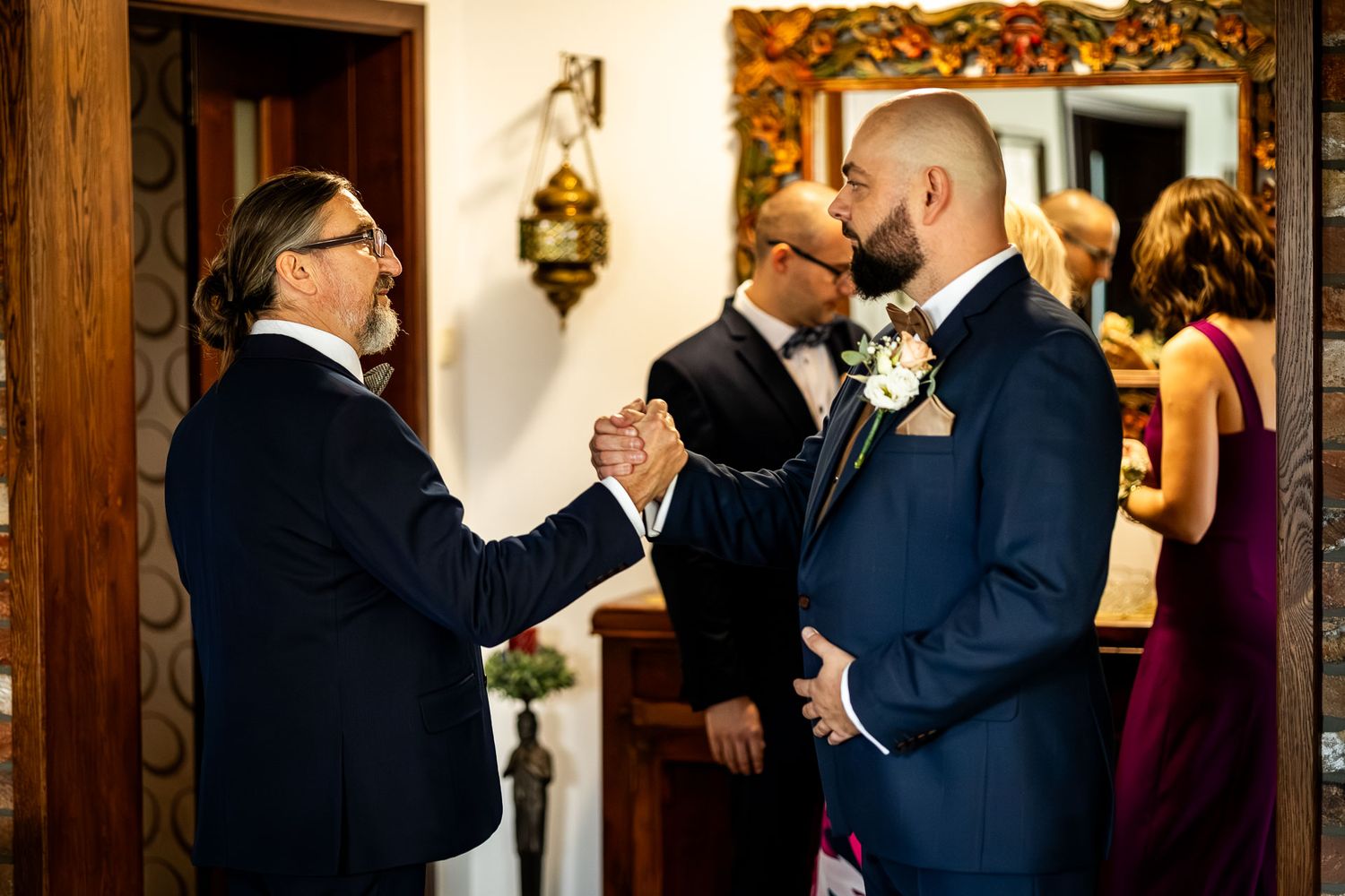 Wedding party members in formal attire sharing celebratory moment.