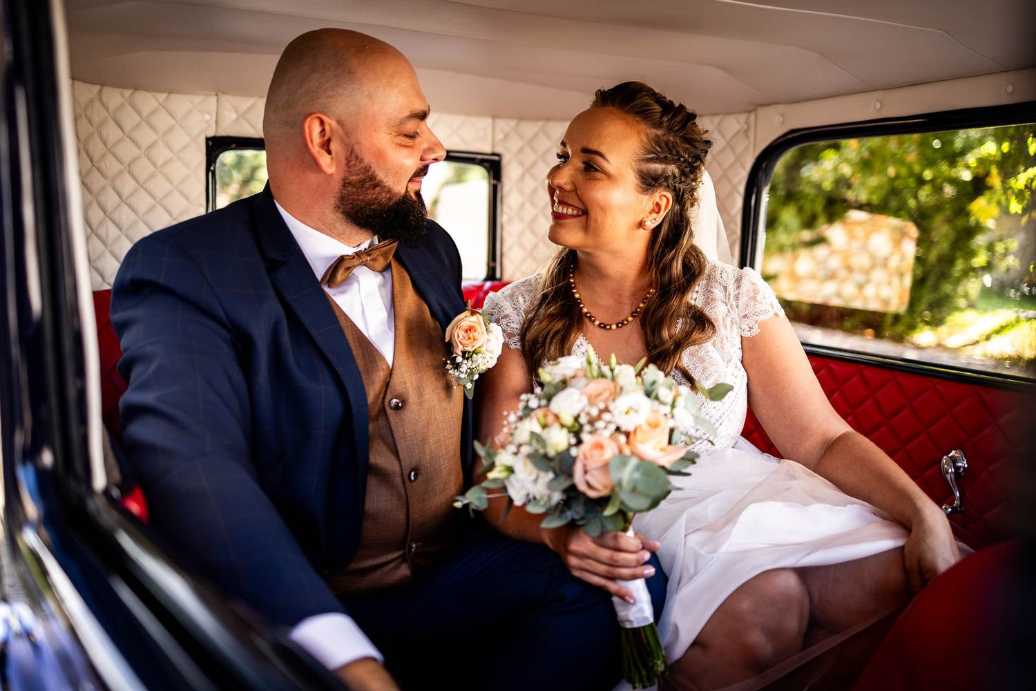Interior of vintage car with elegant wedding details.