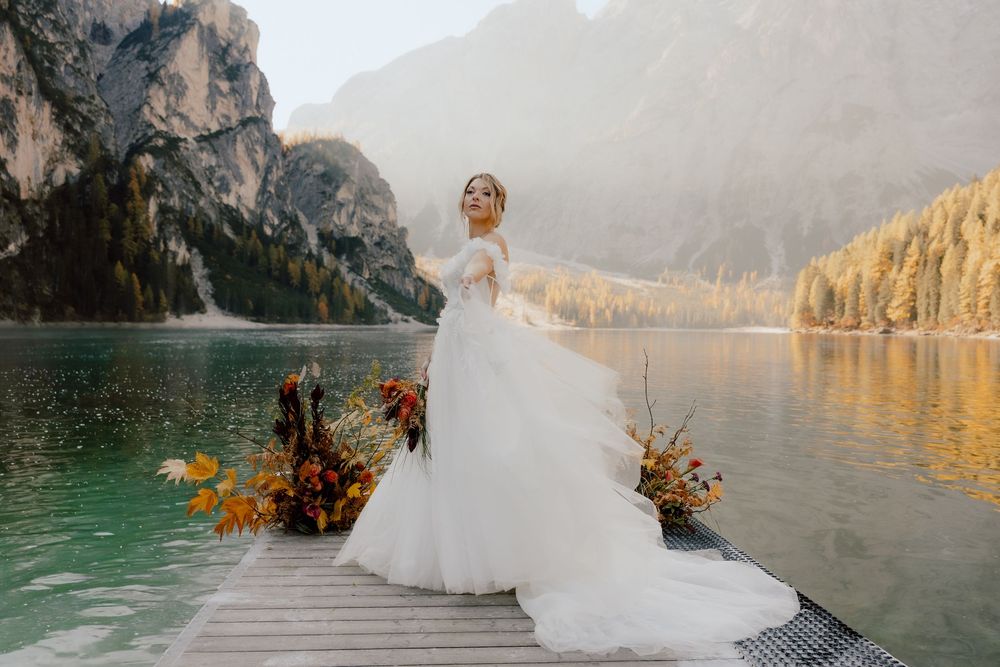 A stunning wedding photo series at Lake Louise in Banff National Park with mountain and lake views at sunset.
