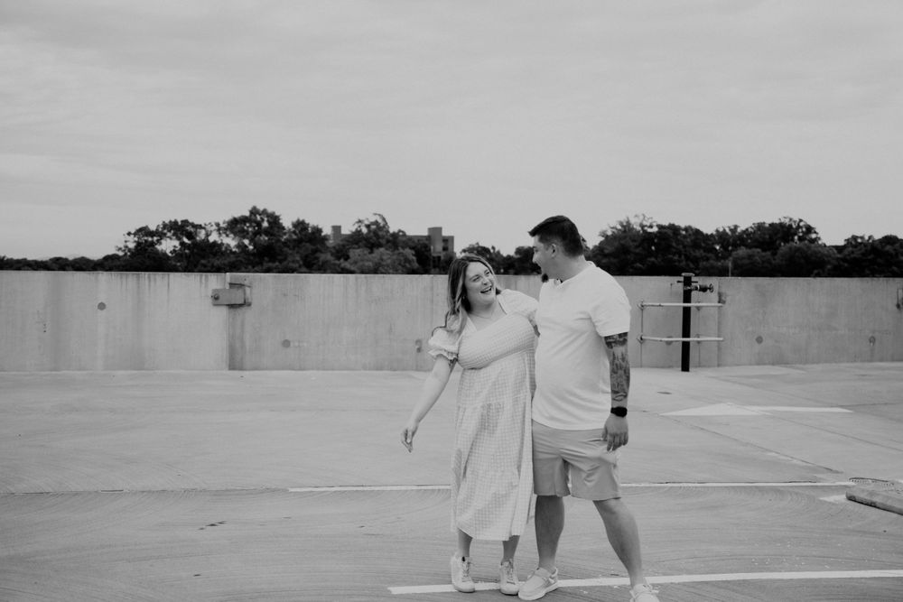 Black and white sequence showing people interacting in an outdoor urban setting.