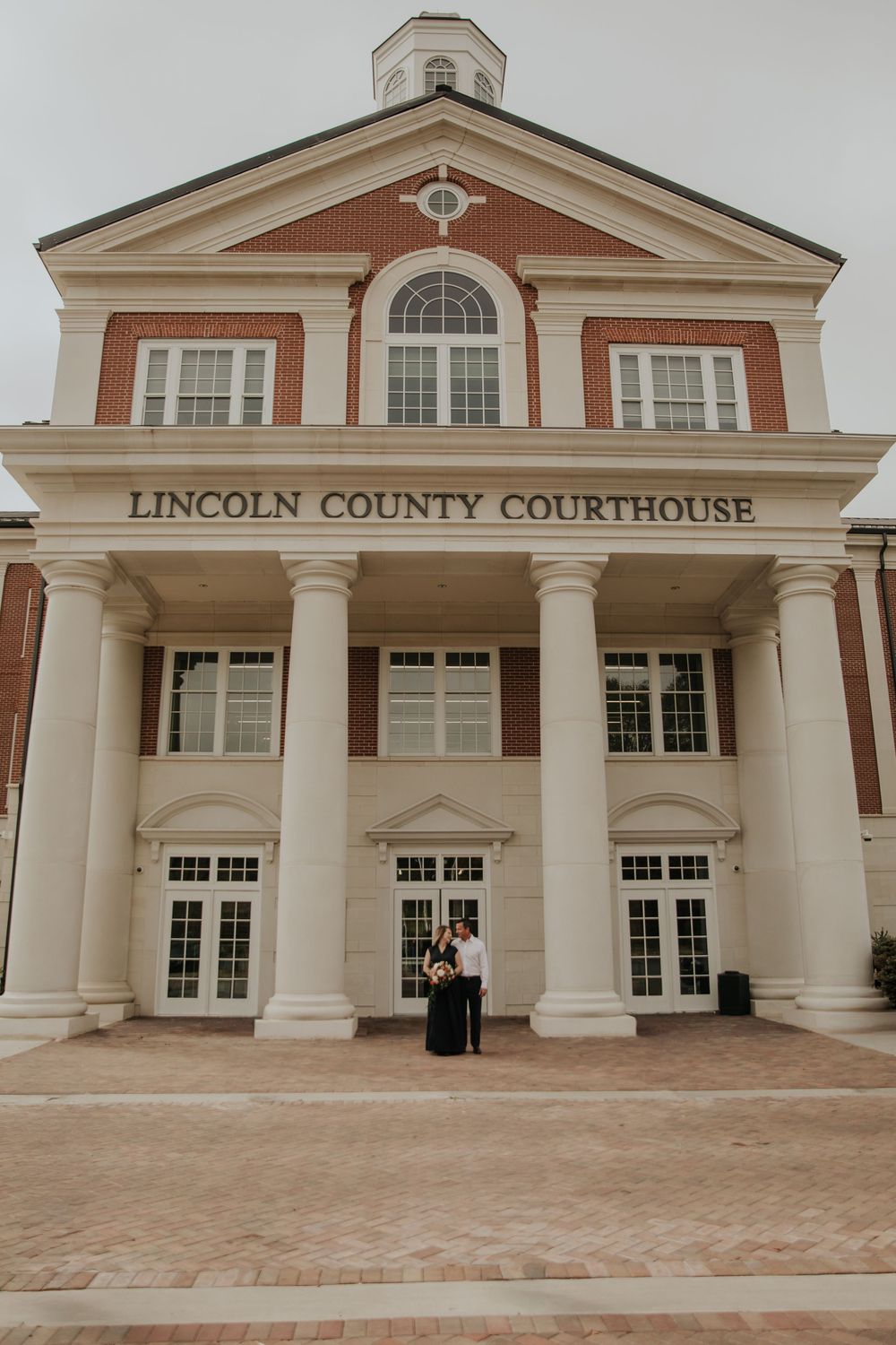 Lincoln County Courthouse facade featuring classical columns and symmetrical architecture.