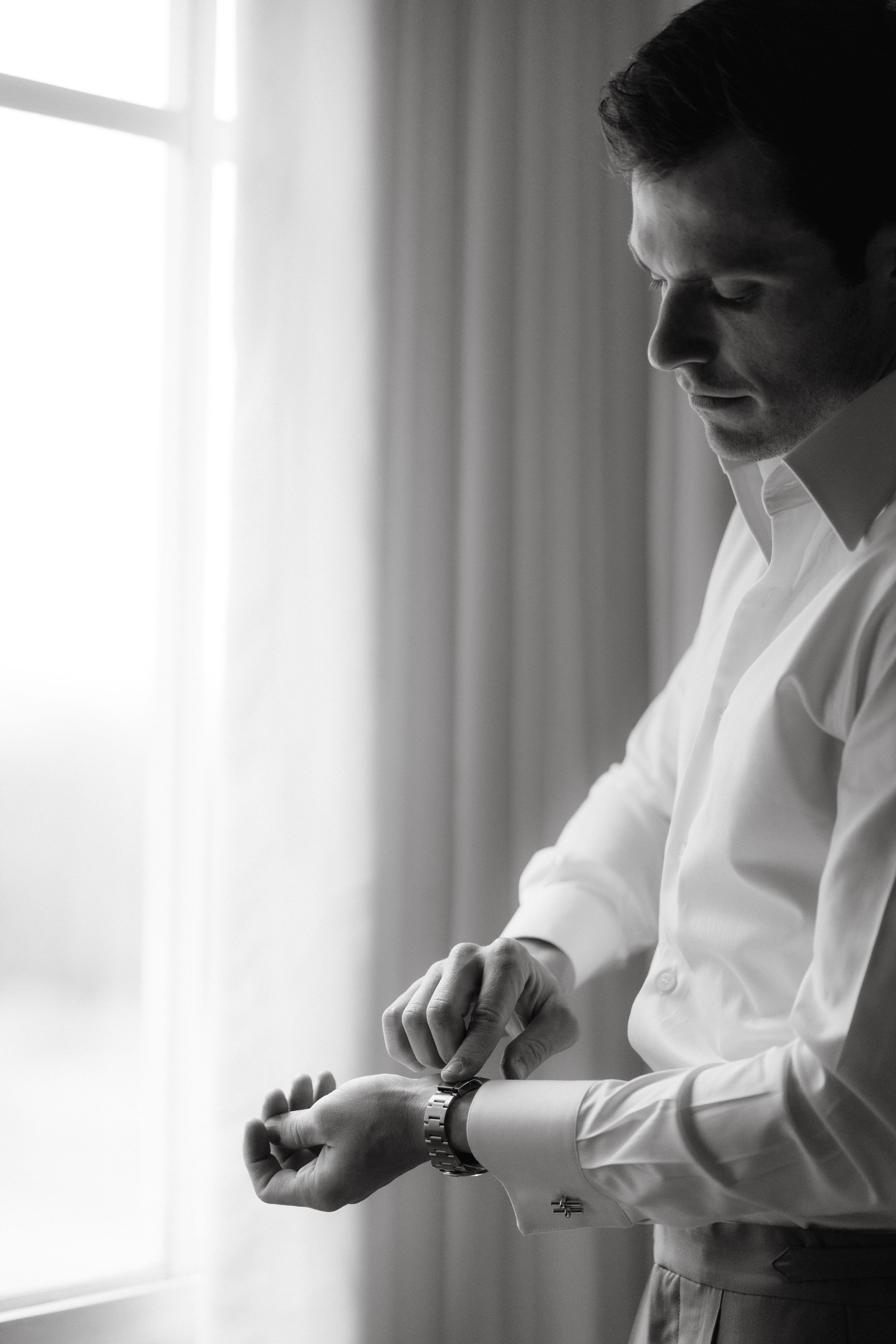 Classic black and white portrait showing preparation before formal event.