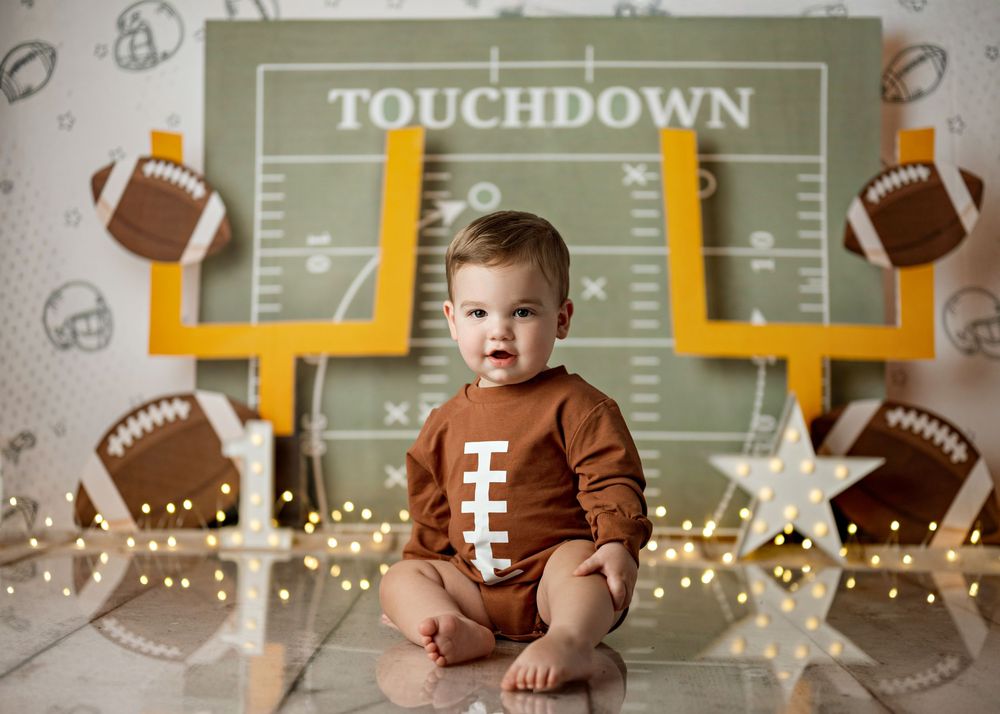 A football themed first birthday photo collage with decorations and a touchdown backdrop.
