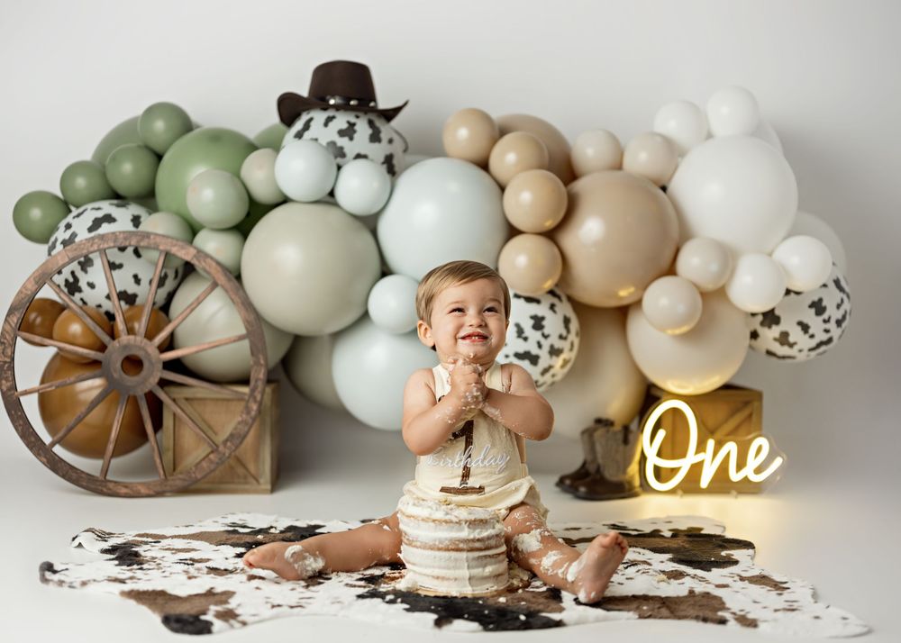 A serene earth-tone balloon garland arrangement with natural elements and rustic decor creates a neutral boho aesthetic.