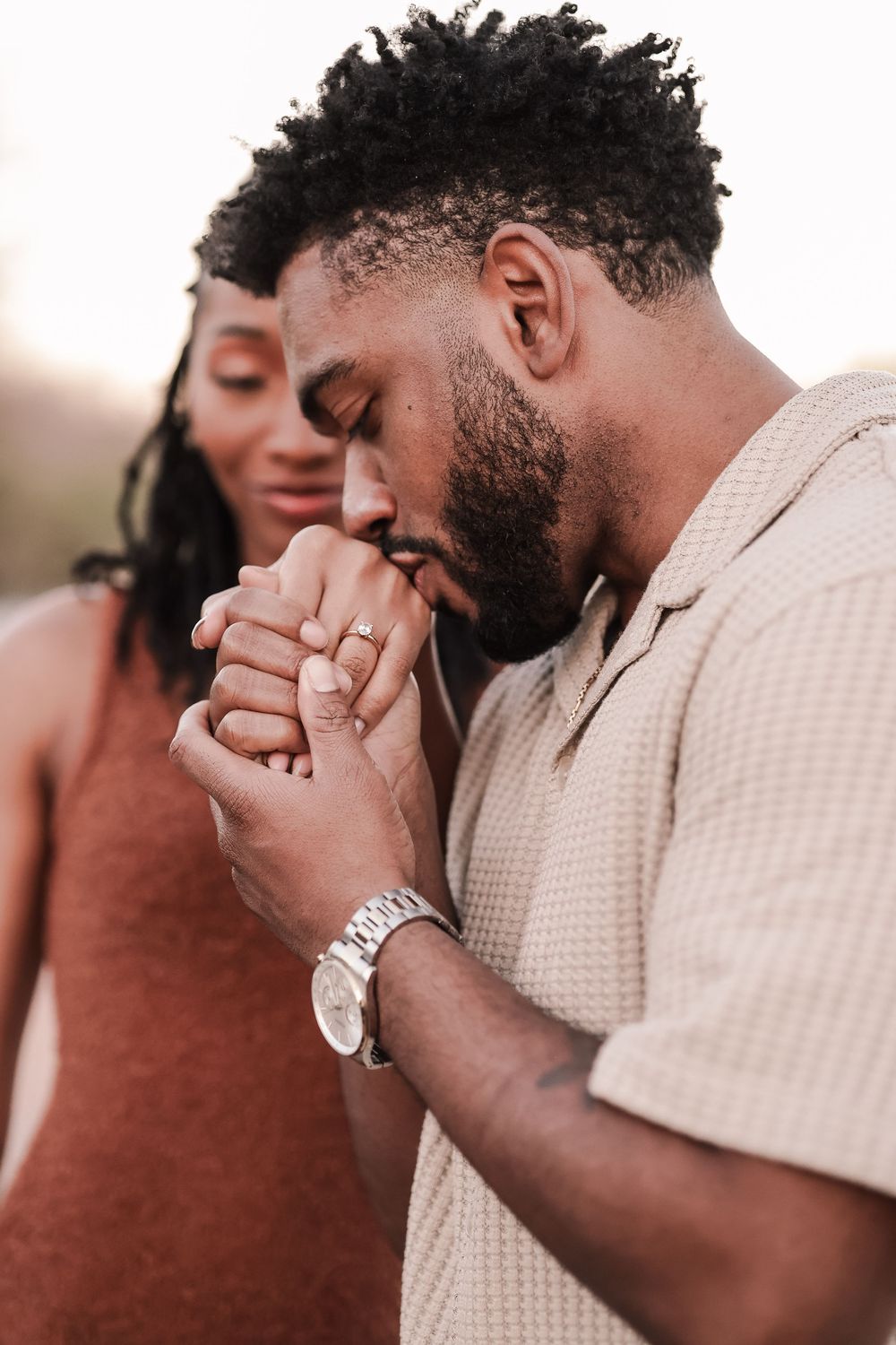 Series of emotional reaction shots showing someone bringing their hands to their face in a touching moment.