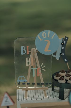 Handmade paper craft animation set with multiple frames showing simple cutout figures on a textured green background.