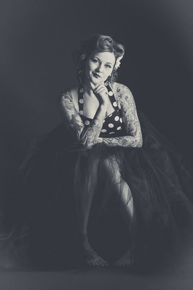 Black and white vintage style portrait of young woman in pin-up dress taken by East Tennessee photographer.