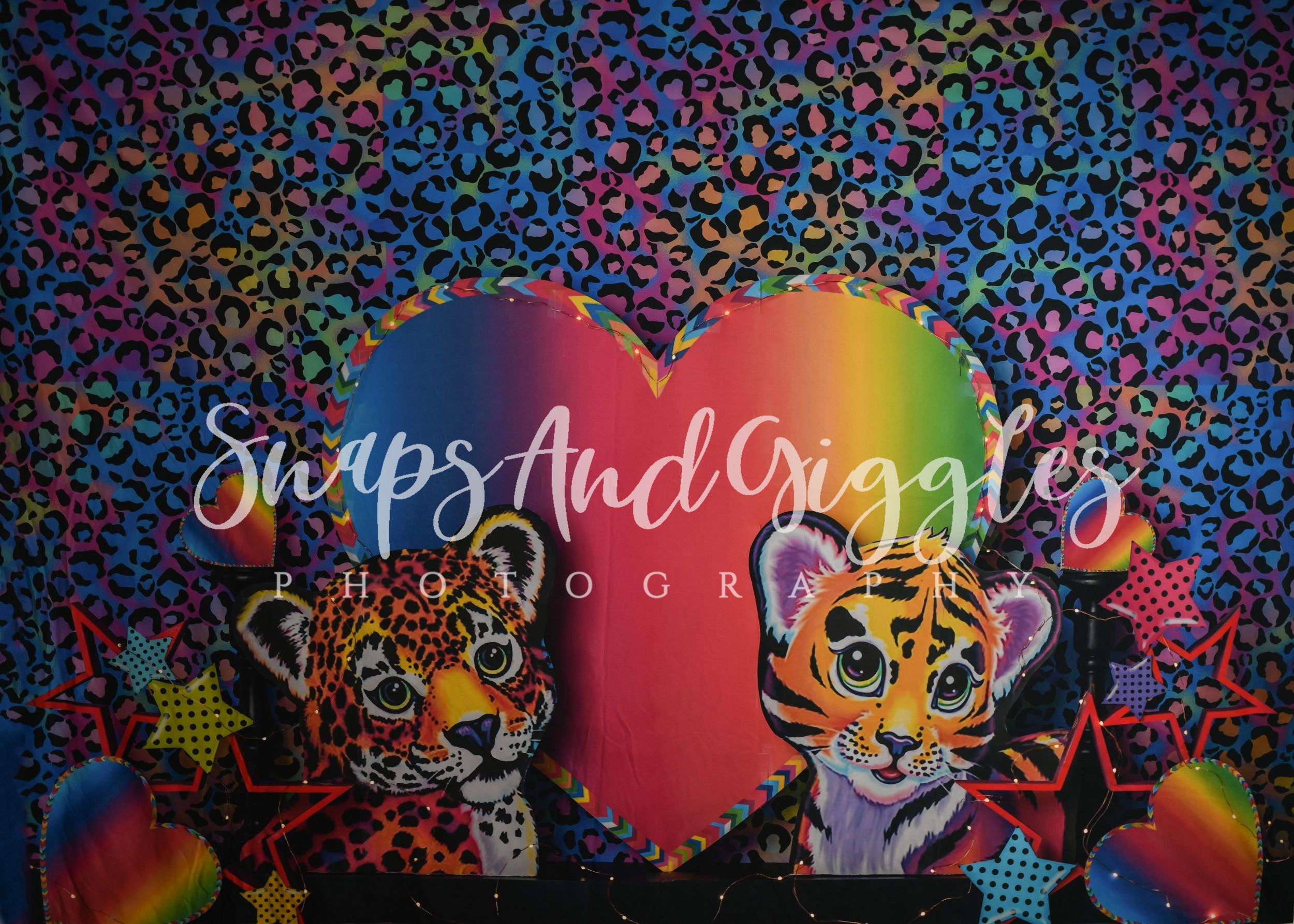 Colorful Lisa Frank-style backdrop with leopard print, rainbow heart, and cartoon tigers for Snaps And Giggles Photography.