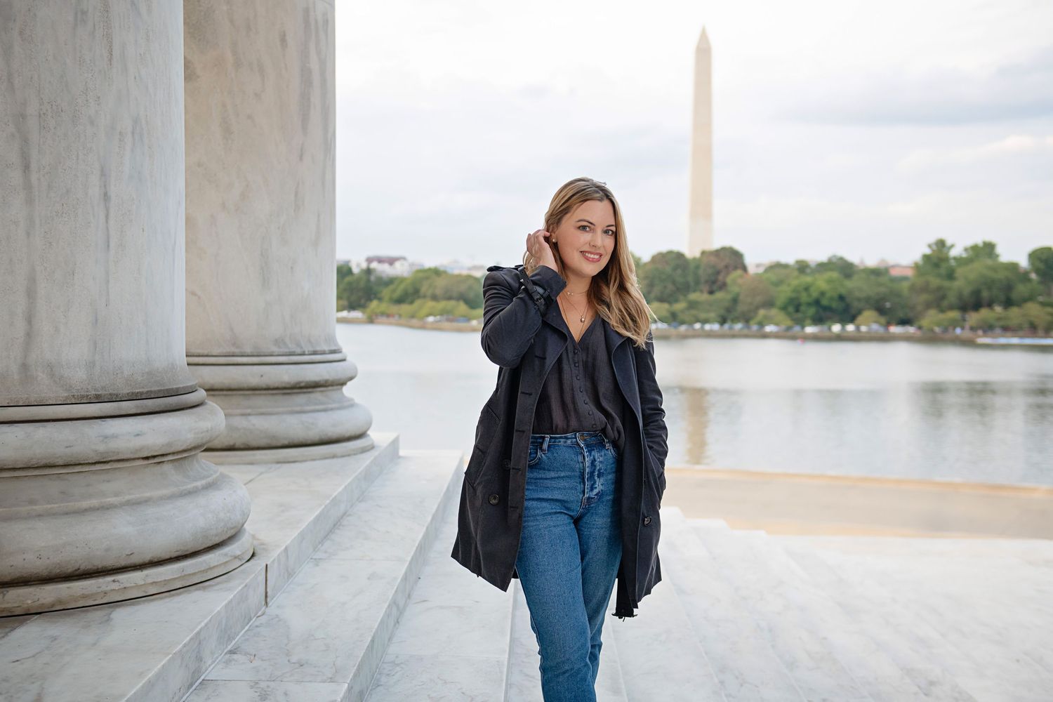 Casual portrait near the Jefferson Memorial with the Washington Monument visible in the background.