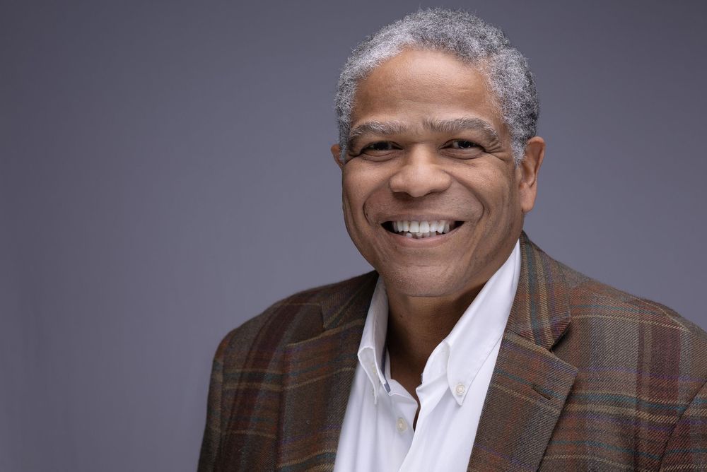 Corporate Headshot of a smiling executive in a plaid jacket | Northern NJ headshots