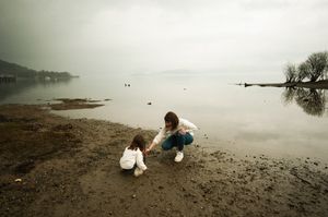 Natural light portrait of a mother with her little girl