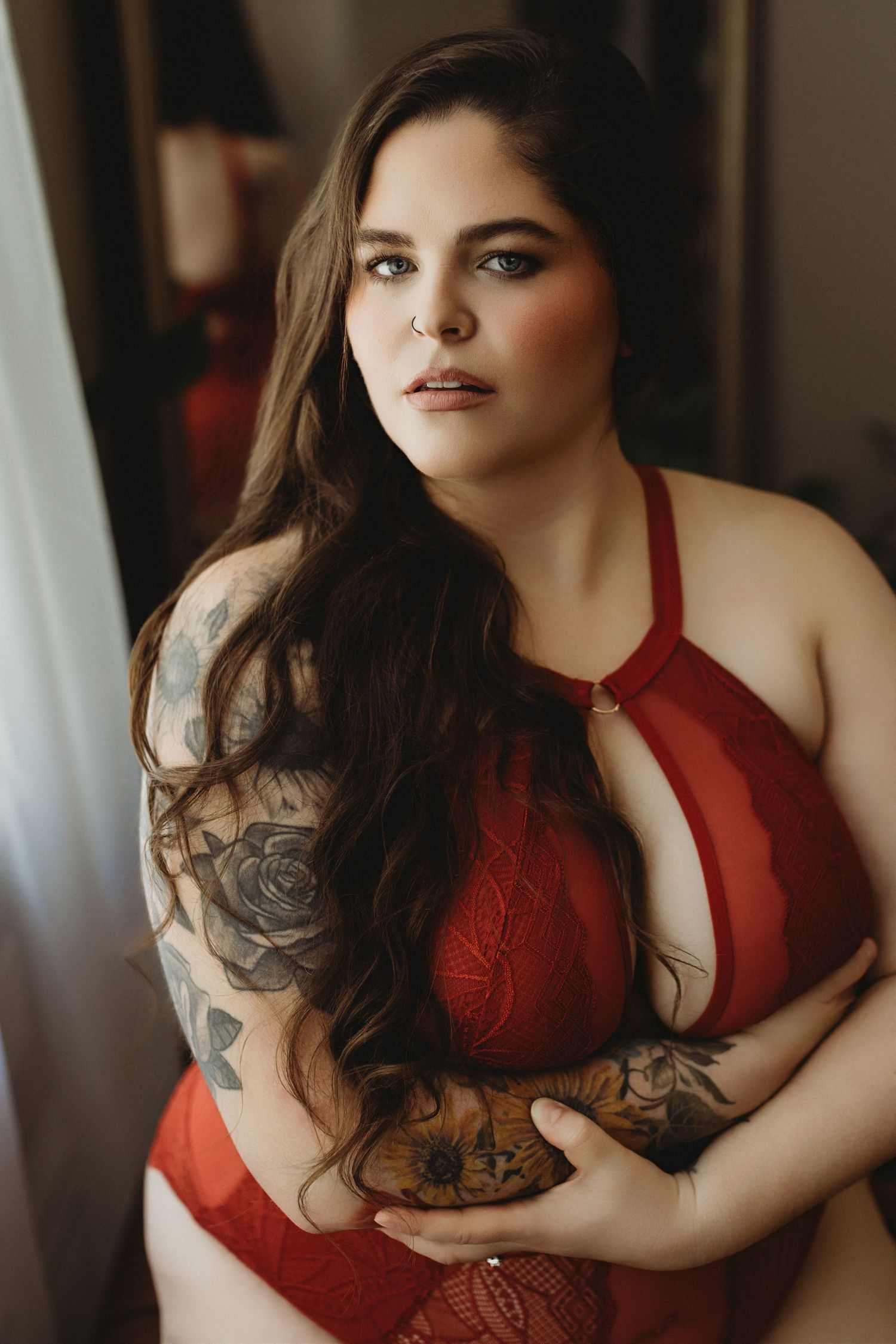 Professional boudoir photo of a woman laying on a couch
